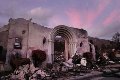 ALTADENA, CA - February 14: Views of the Altadena Community Church were destroyed in the Eaton Fire and dusk fell on February 14, 2025 in Altadena, California. The Federal Emergency Administration (FEMA) and the Army Corps of Engineers are removing debris of private property from the Eaton and Palisade fires. (Photo by Mario Tama/Getty Images)