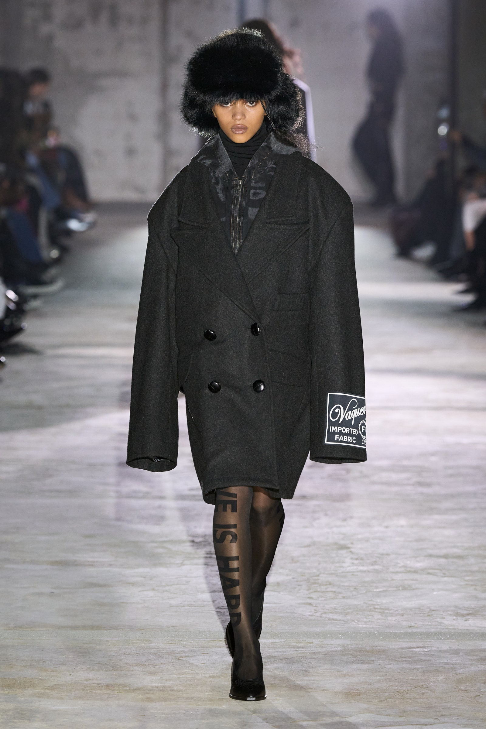 Images may contain Aya Jones clothing coat adult fashion coat and hat