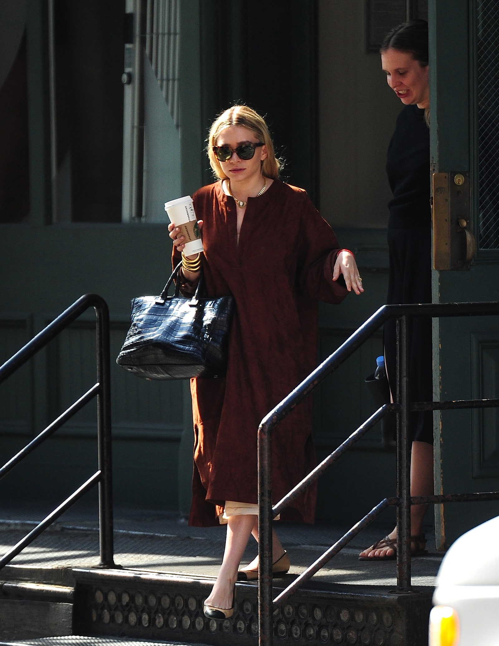 Images may contain Ashley Olsen Accessories Bag Handbag Glass Cup Adult Jewelry and Necklace