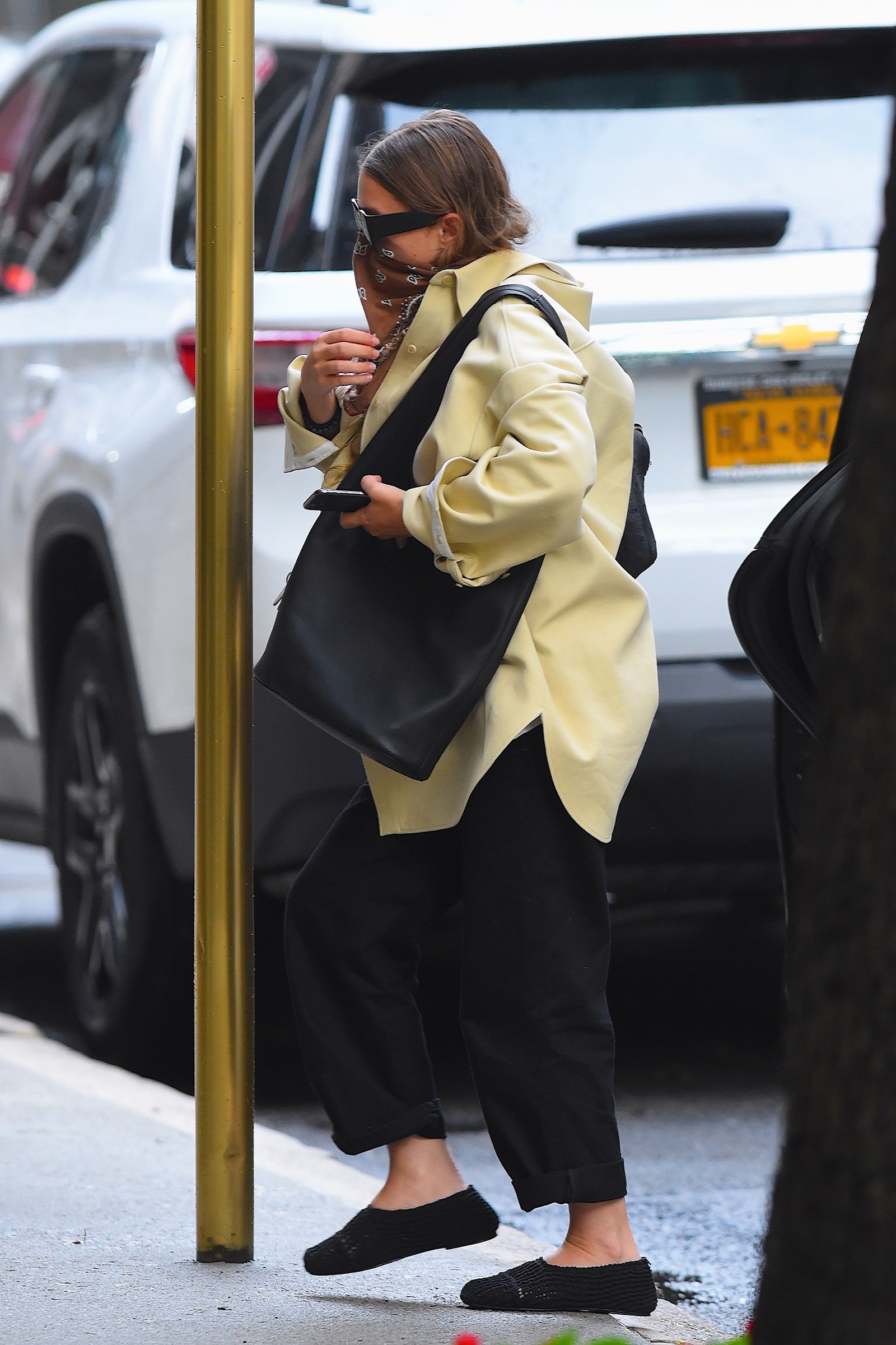 Images may contain clothes, coats, adult pedestrian jacket accessories, tote bags, tote bags and transport