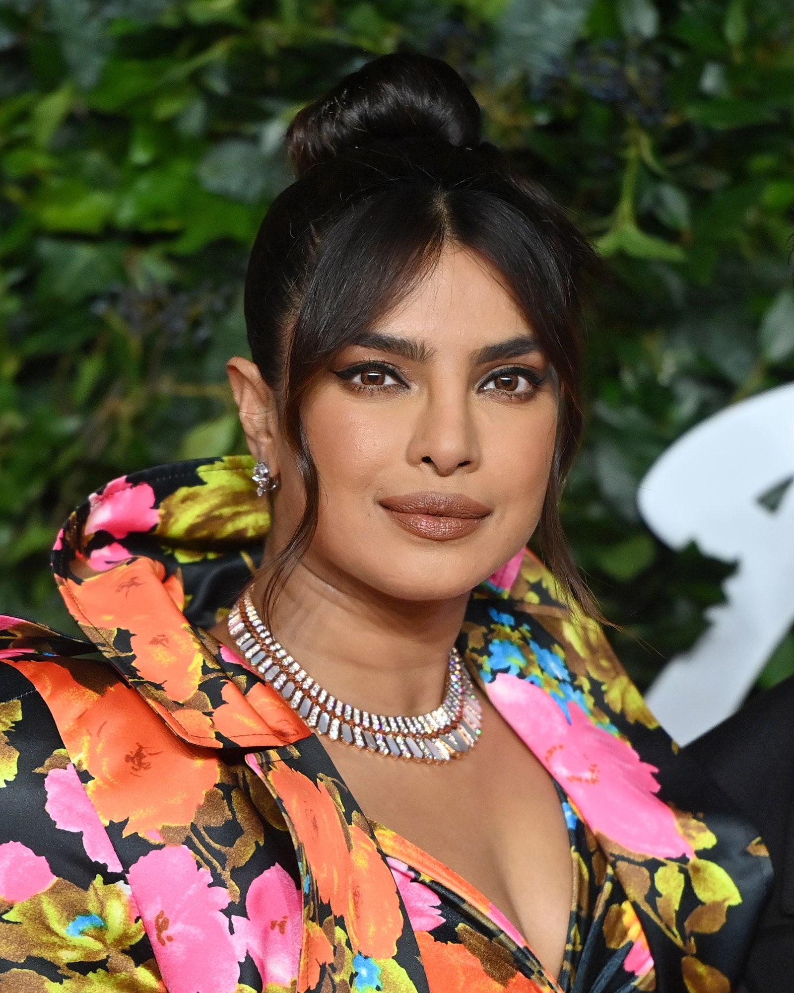 Images may contain Priyanka Chopra adult head and face black hair accessories and necklace