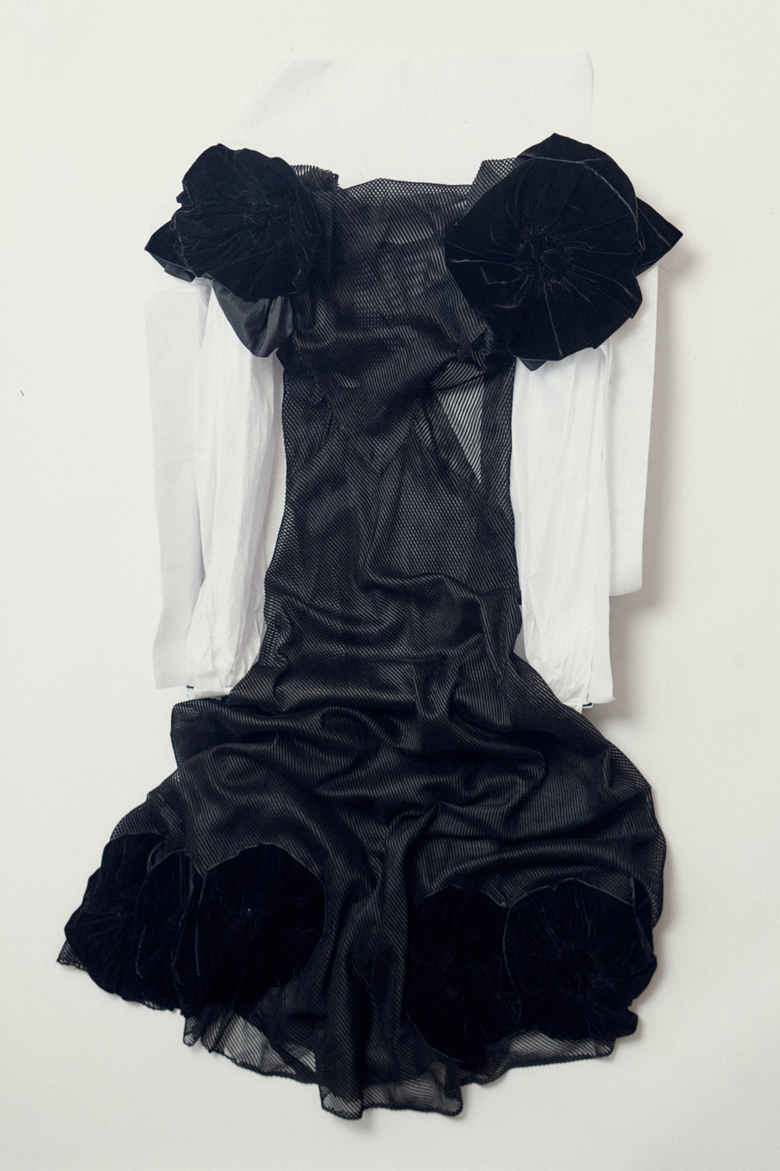 Images may contain shirt clothing dress formally wearing jacket and evening dress