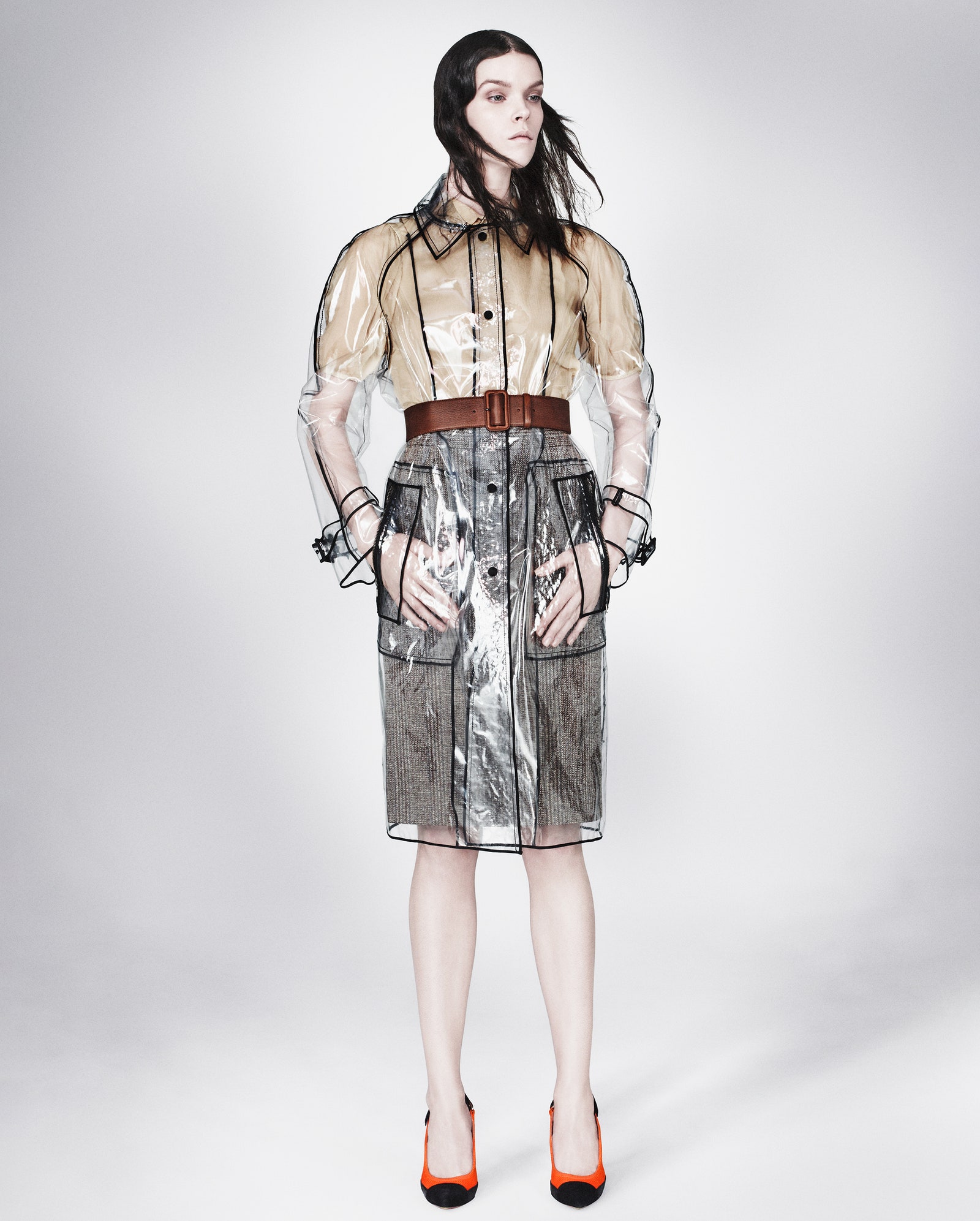 Images may contain clothing jacket accessories belt adult footwear high heels and long sleeves