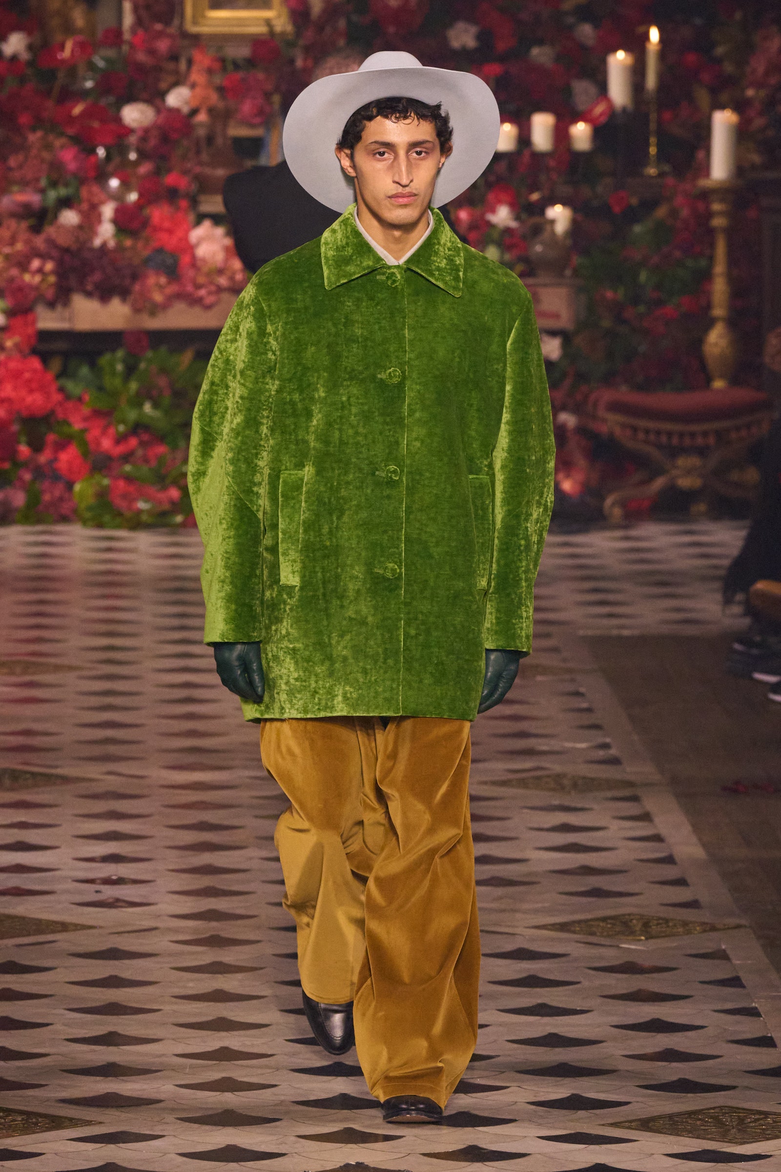 Image may contain Salih Uçan Clothing Glove Hat Adult Person Footwear Shoe Standing Candle Pants and Performer