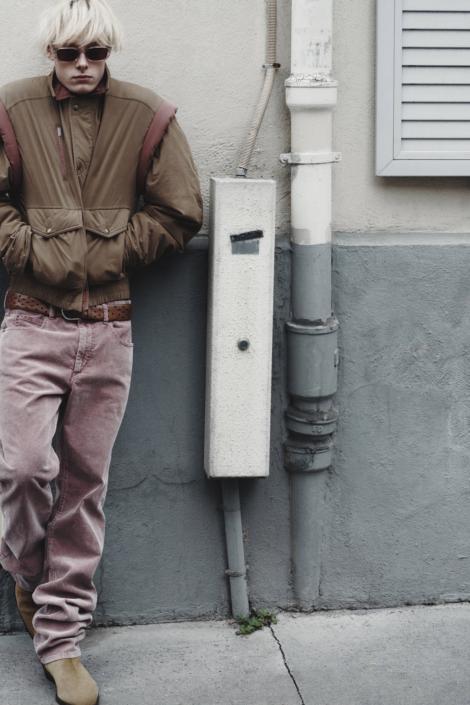 Image may contain Clothing Pants Accessories Belt Adult Person Jeans Glasses Coat Jacket Footwear and Shoe