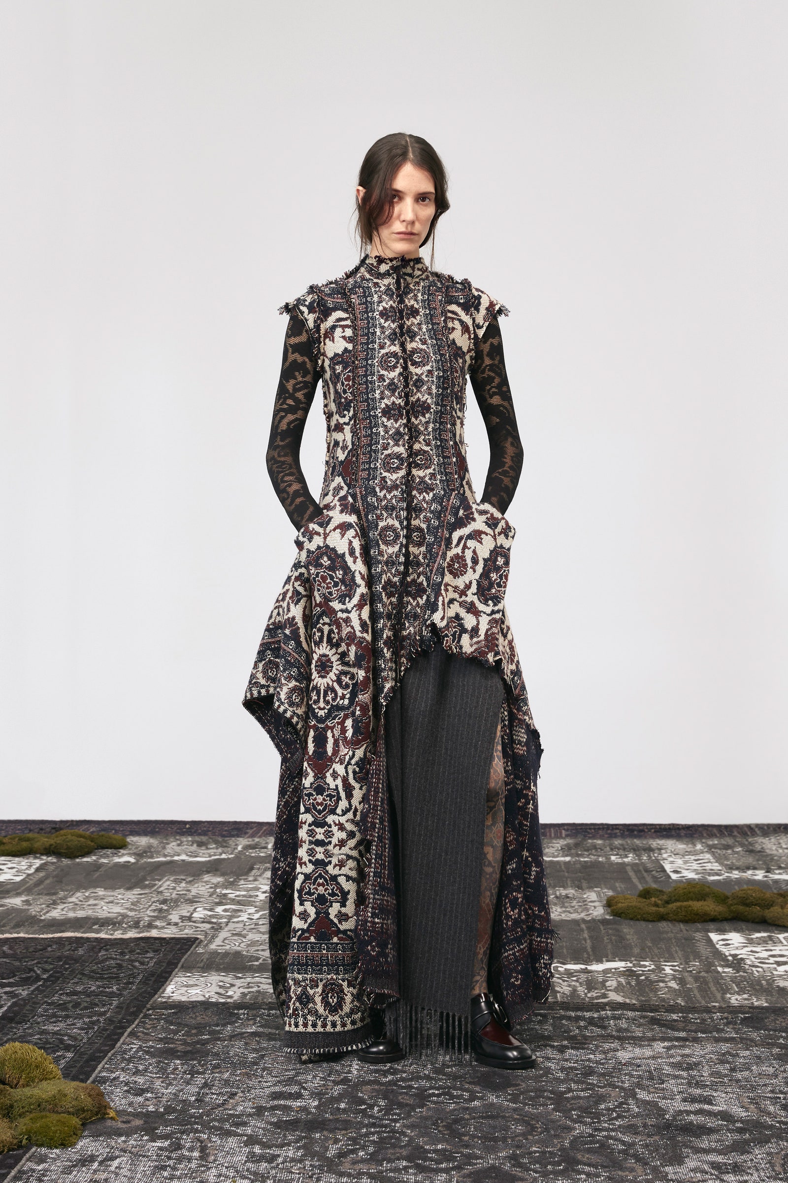 Image may contain Person Standing Adult Clothing Dress Coat Footwear and Shoe