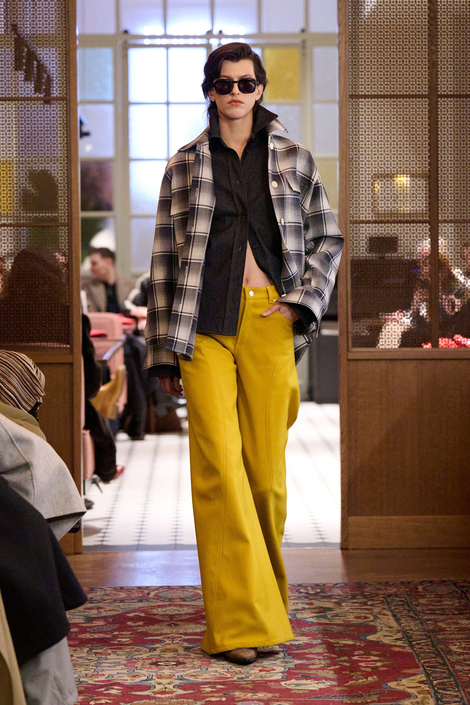 Image may contain Adam Pallin Clothing Pants Coat Fashion Accessories Glasses Adult Person Footwear and Shoe