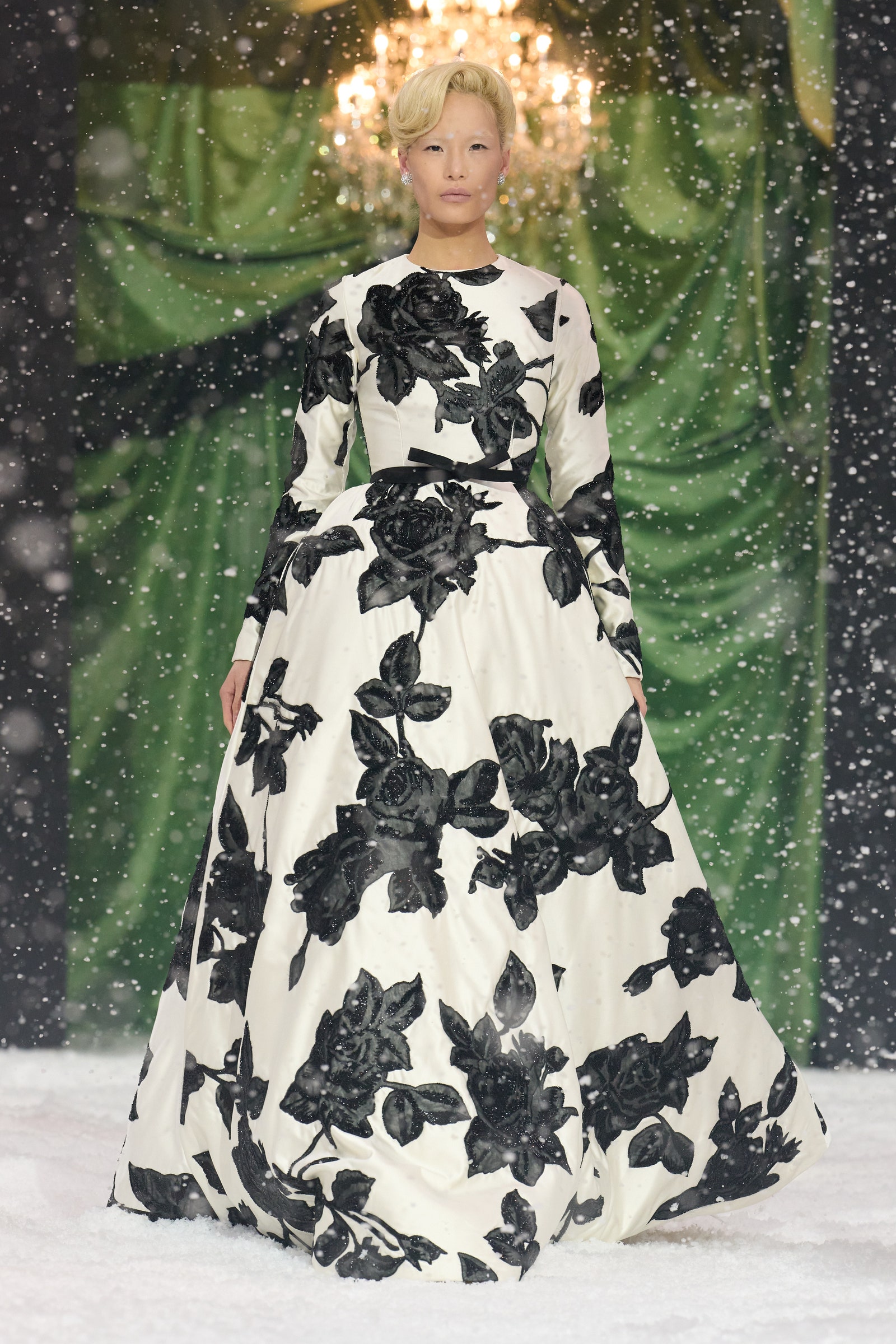 Image may contain Clothing Dress Person Formal Wear Fashion Gown Adult Wedding Wedding Gown and Glove