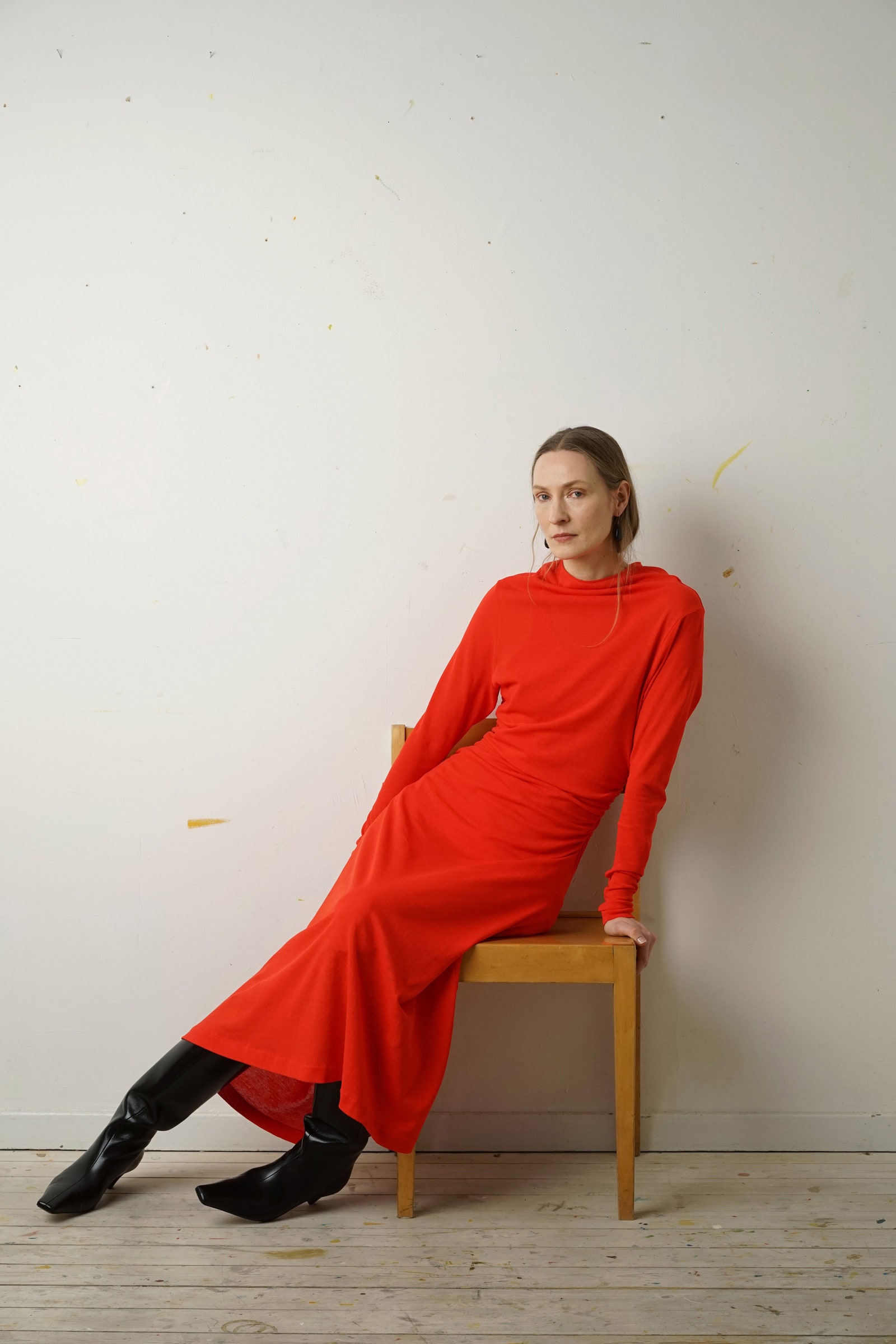 Image may contain Clothing Footwear Shoe Adult Person Chair Furniture Sitting High Heel Dress and Head