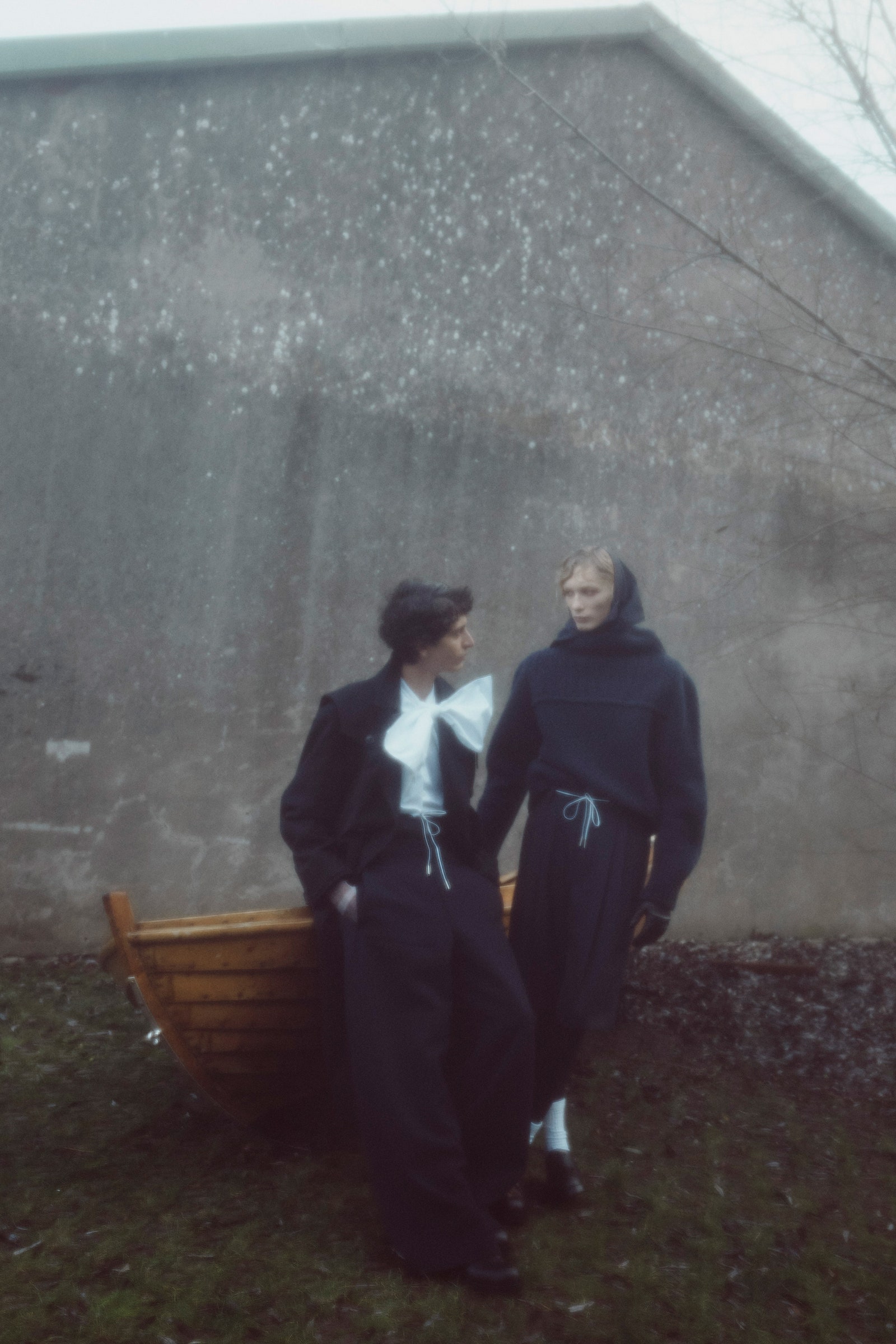 Image may contain Clothing Coat Blazer Jacket Formal Wear Suit Face Head Person Photography Portrait and Pants