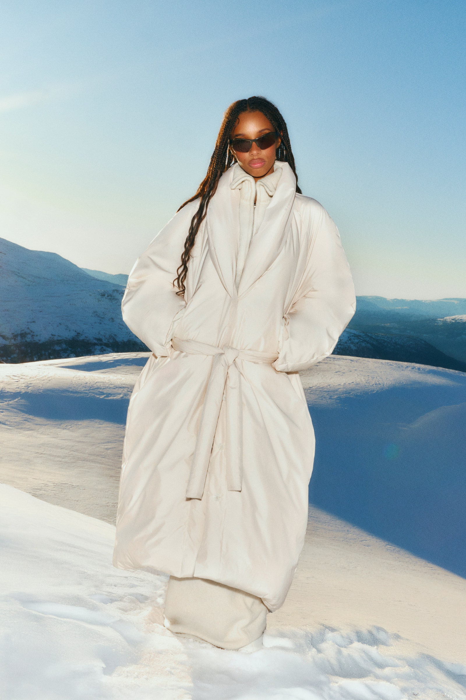 Image may contain Ester Rada Clothing Coat Face Head Person Photography Portrait Fashion Adult and Accessories