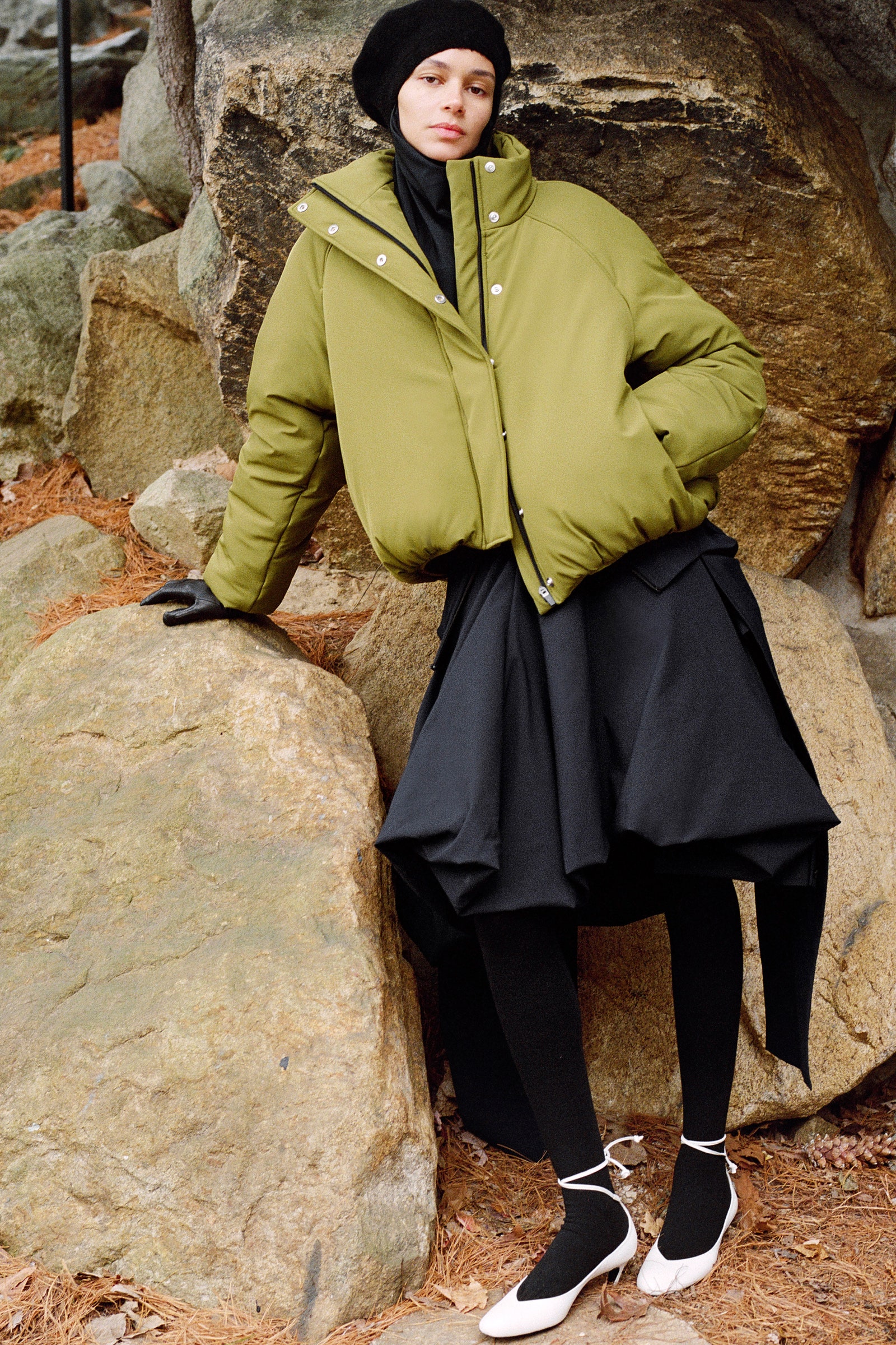 Image may contain Binx Walton Clothing Coat Jacket Rock Slate Glove Adult Person Hat Footwear High Heel and Shoe