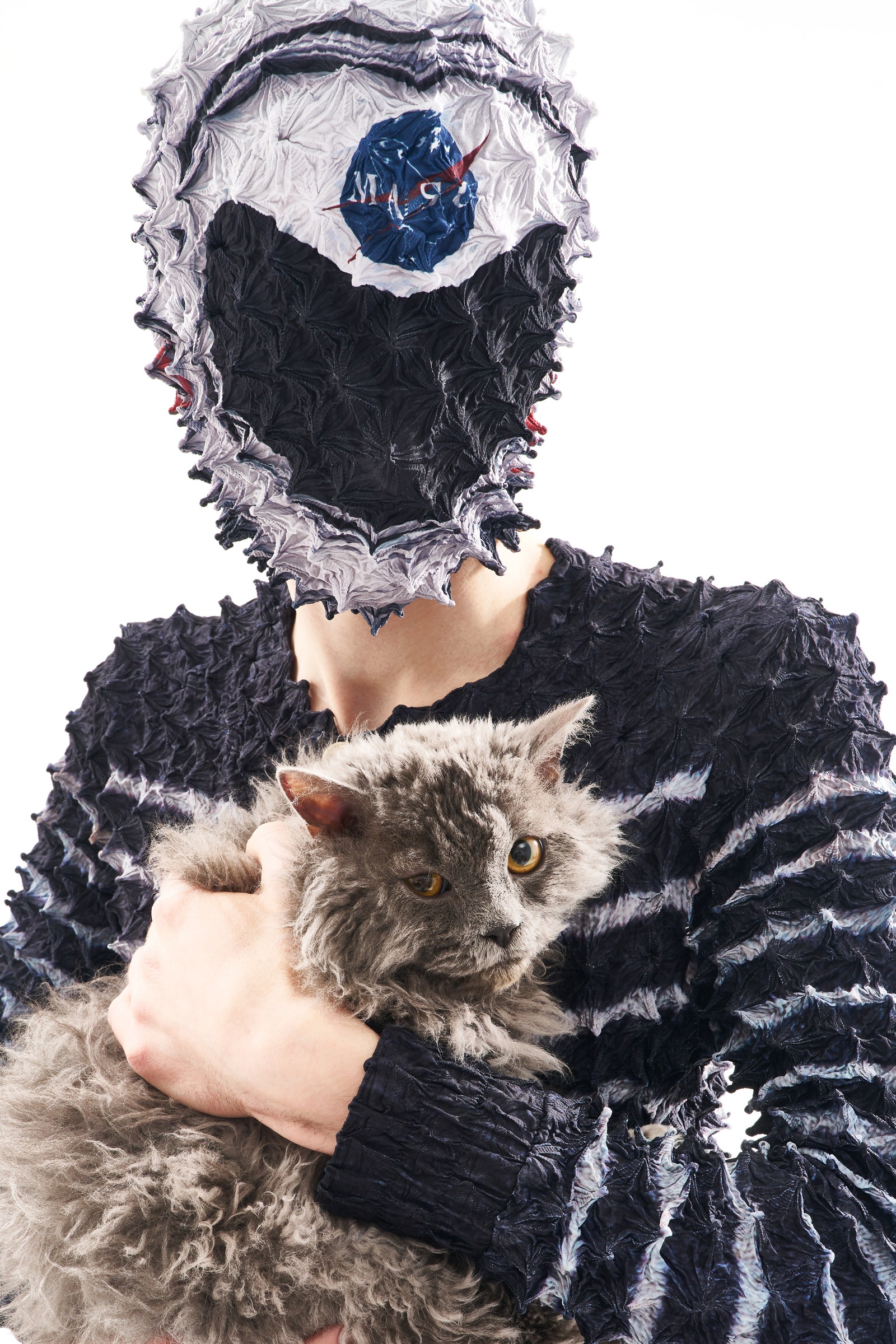 Image may contain Clothing Hat Face Head Person Photography Portrait Toy Animal Cat Mammal Pet and Pinata