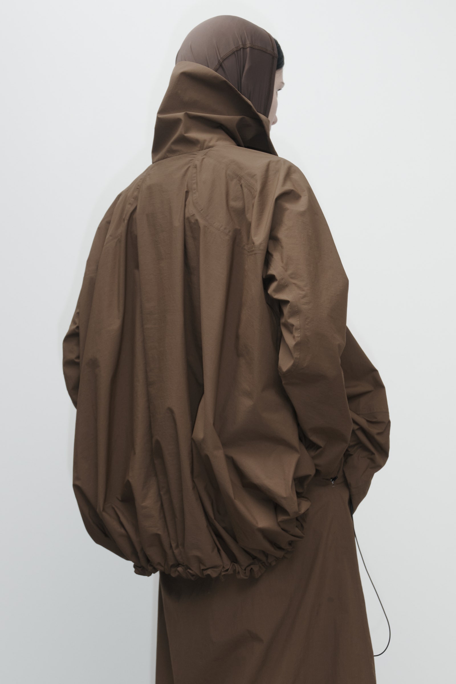 Image may contain Clothing Coat Jacket Adult and Person