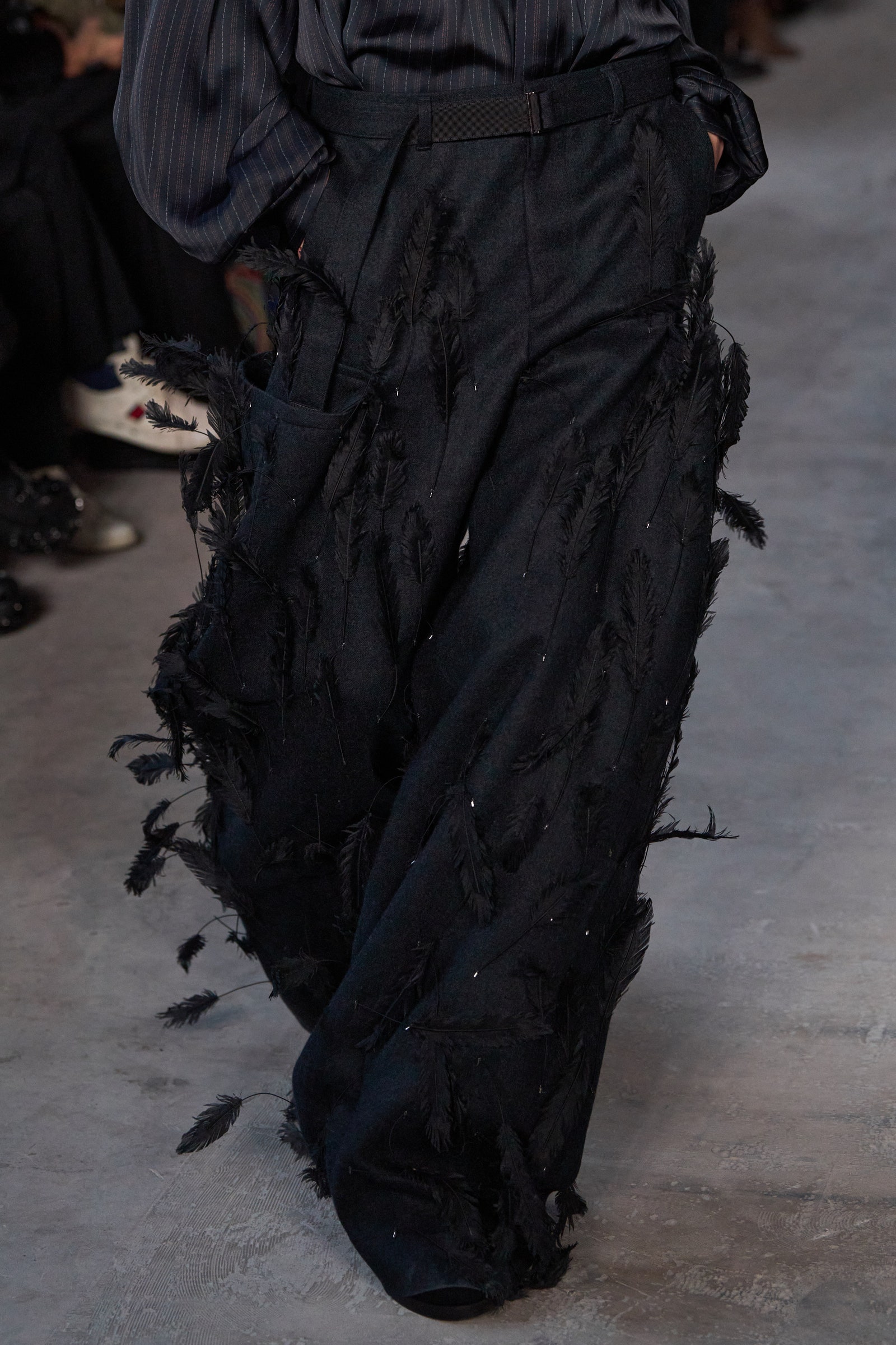 Image may contain Clothing Pants Adult Person Walking Footwear and Shoe