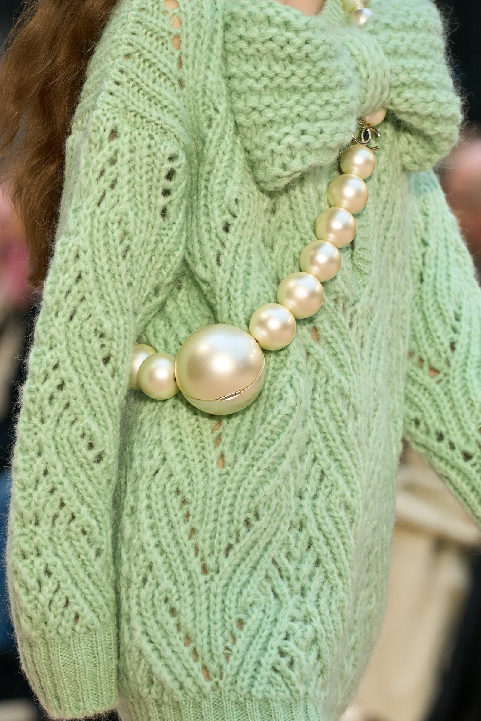 Image may contain Clothing Knitwear Sweater Accessories and Jewelry