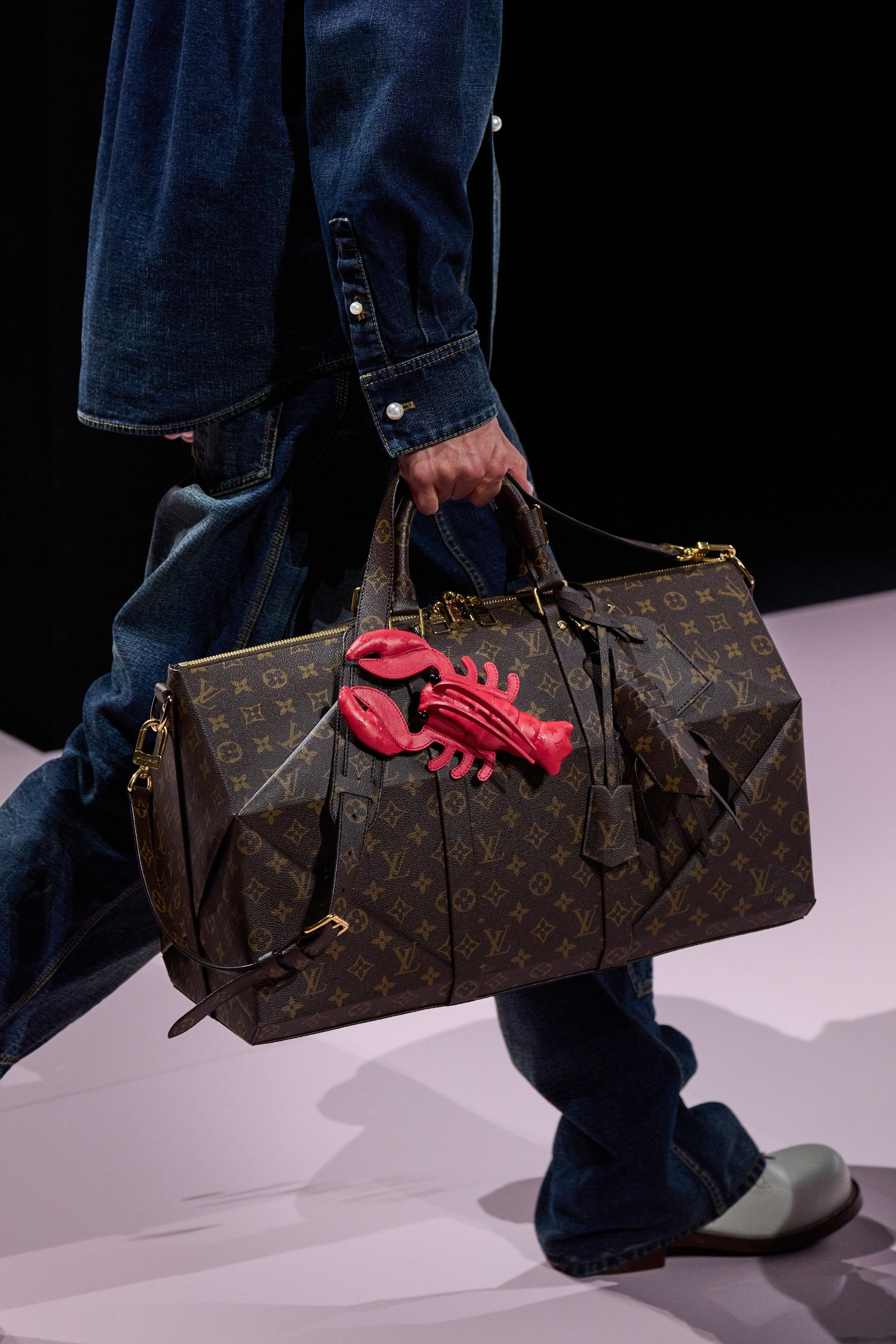 Image may contain Accessories Bag Handbag Clothing Glove Footwear Shoe Adult Person Purse Baggage and Pants