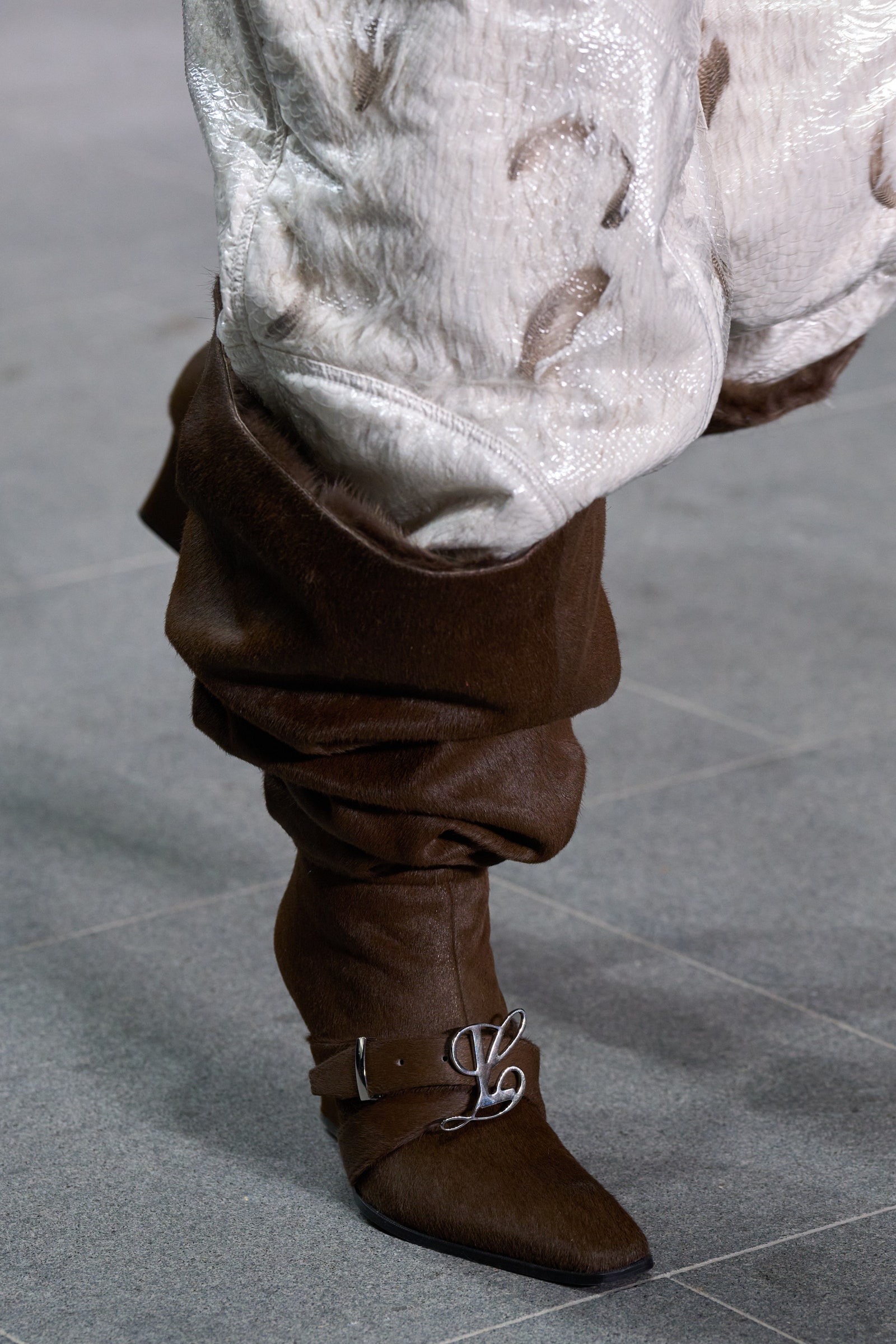 Image may contain Child Person Boot Clothing Footwear and Shoe