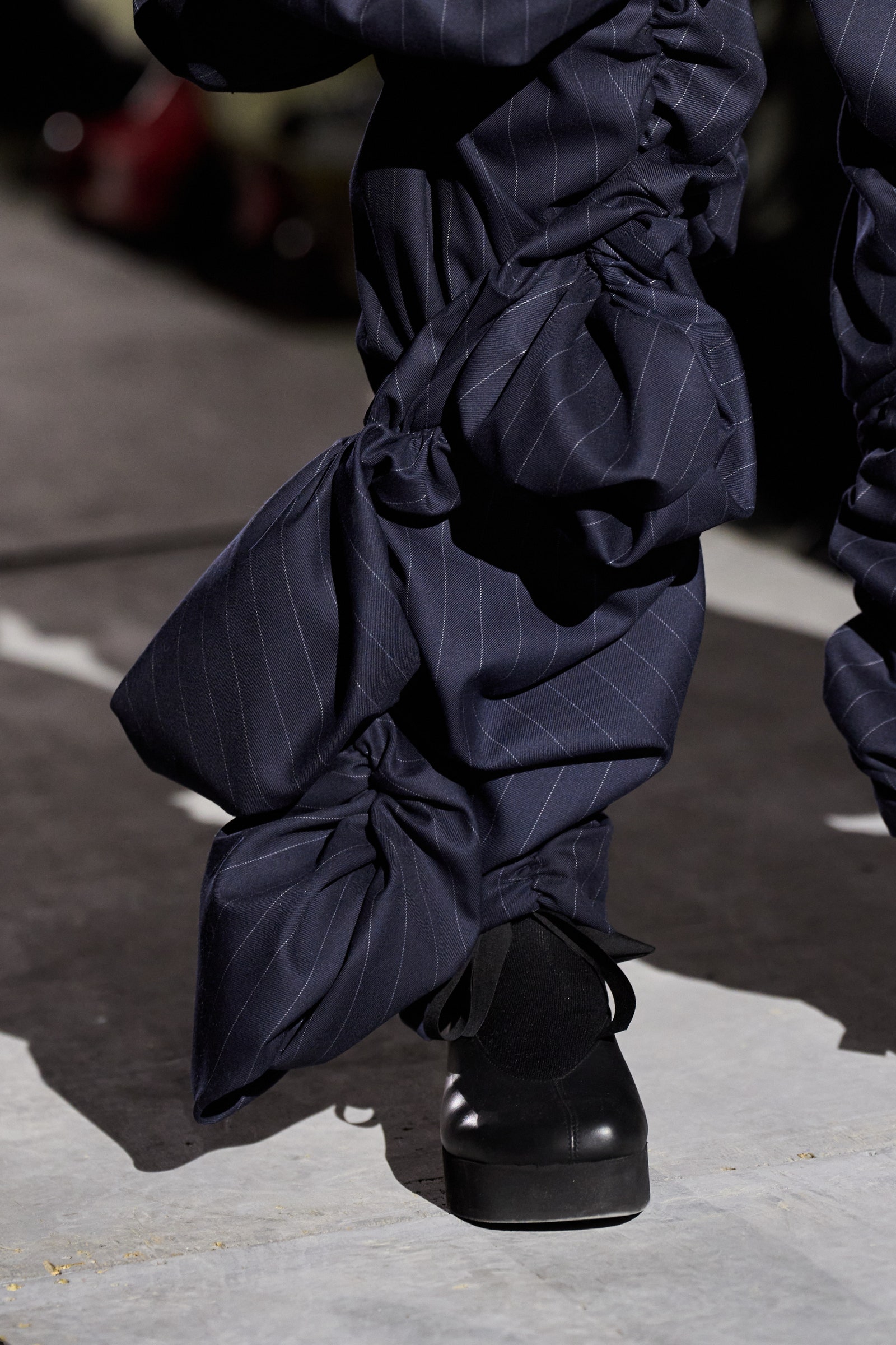 Image may contain Clothing Footwear Shoe Person Walking Adult Sneaker and High Heel