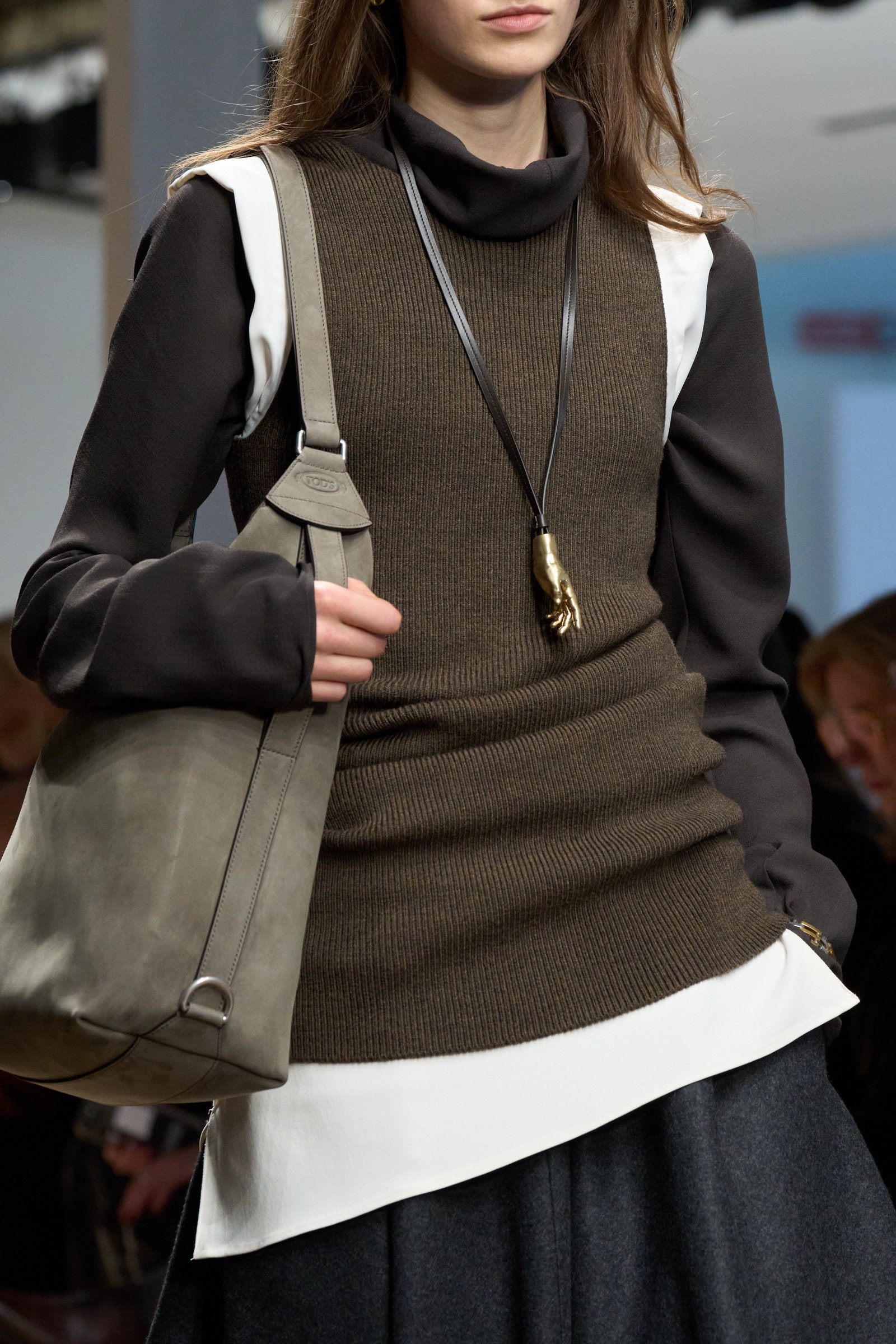 Image may contain Accessories Bag Handbag Purse Jewelry Necklace Adult Person Blazer Clothing Coat and Jacket