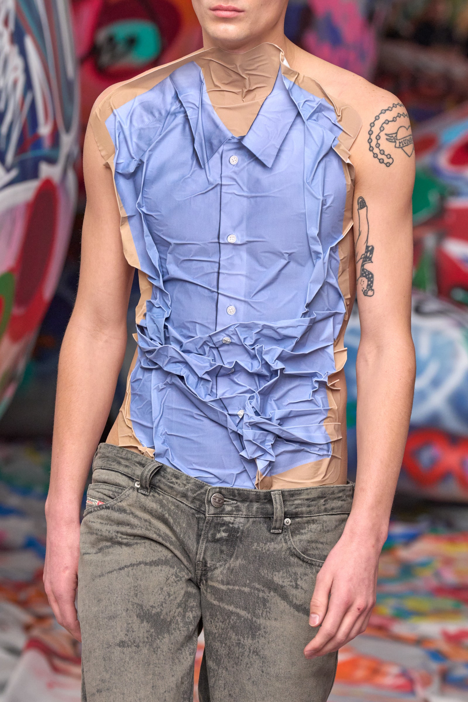 Image may contain Clothing Sleeve Pants Adult Person Blouse and Jeans