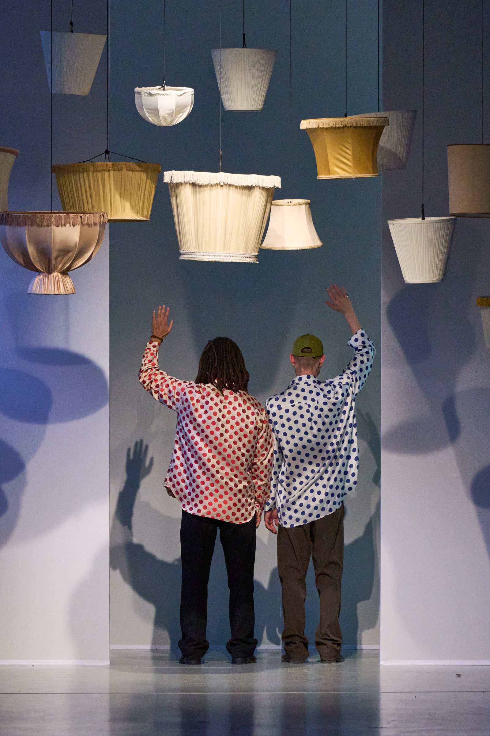 Image may contain Lighting Blouse Clothing Floor Hat Lamp Flooring Adult Person Indoors Interior Design and Pants