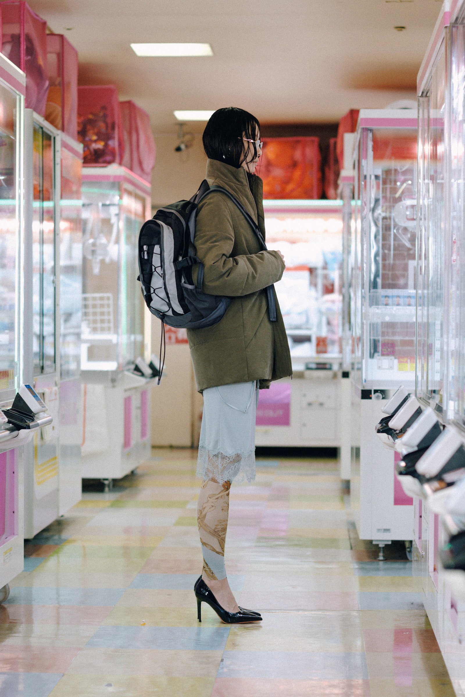 Image may contain Clothing Footwear High Heel Shoe Backpack Bag Adult Person Accessories Glasses and Handbag