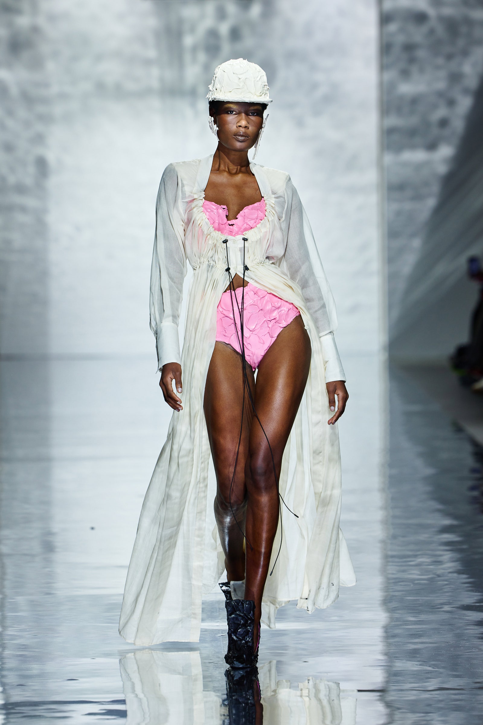 Image may contain Fashion Adult Person Helmet and Runway