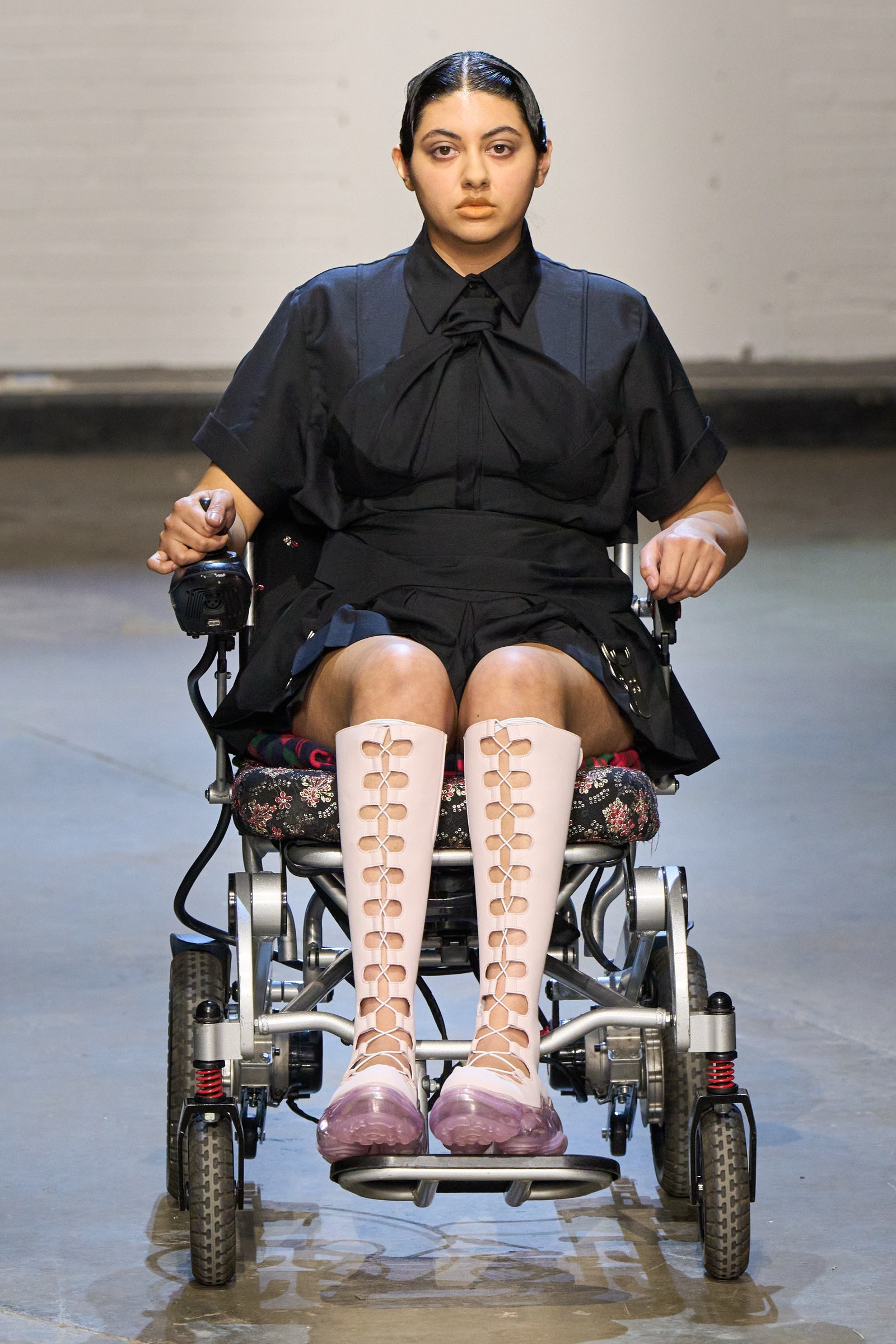Image may contain Person Sitting Adult Clothing Footwear and Shoe