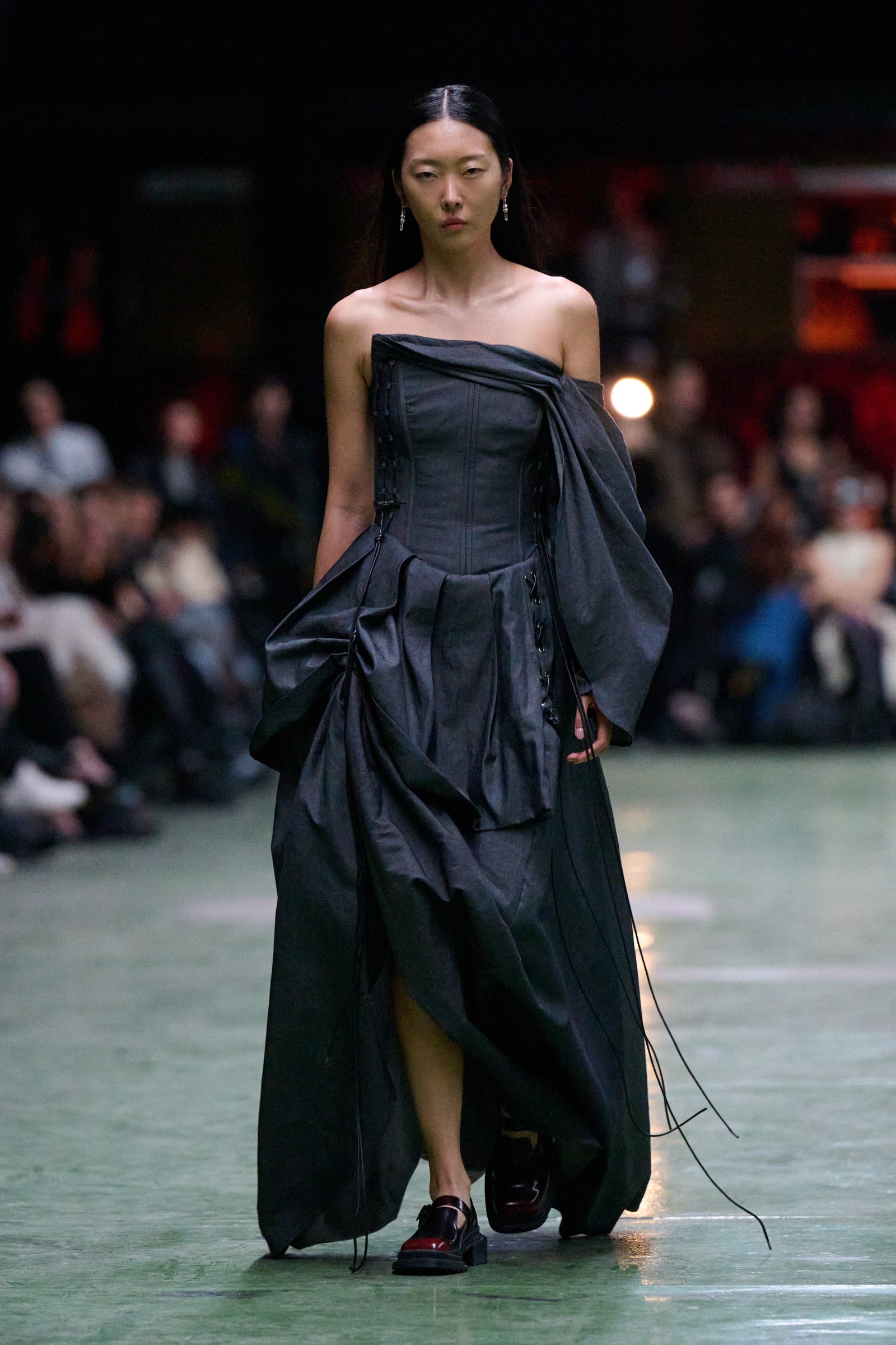 Image may contain Kim Sunghee Fashion Adult Person Clothing Dress Formal Wear Footwear Shoe and Performer