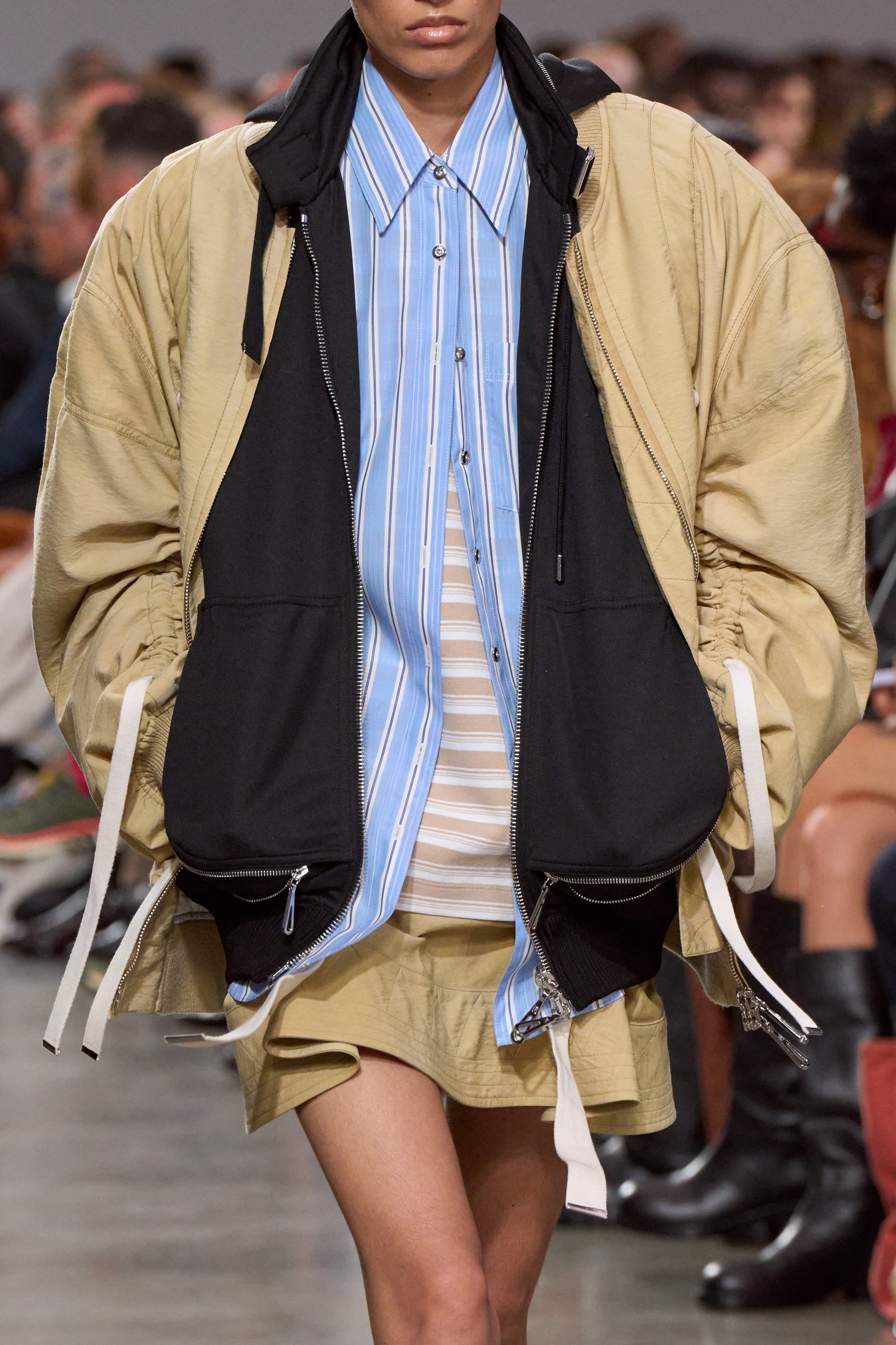 Images may contain clothing jacket shorts adult fashion pioneer shoes and kids