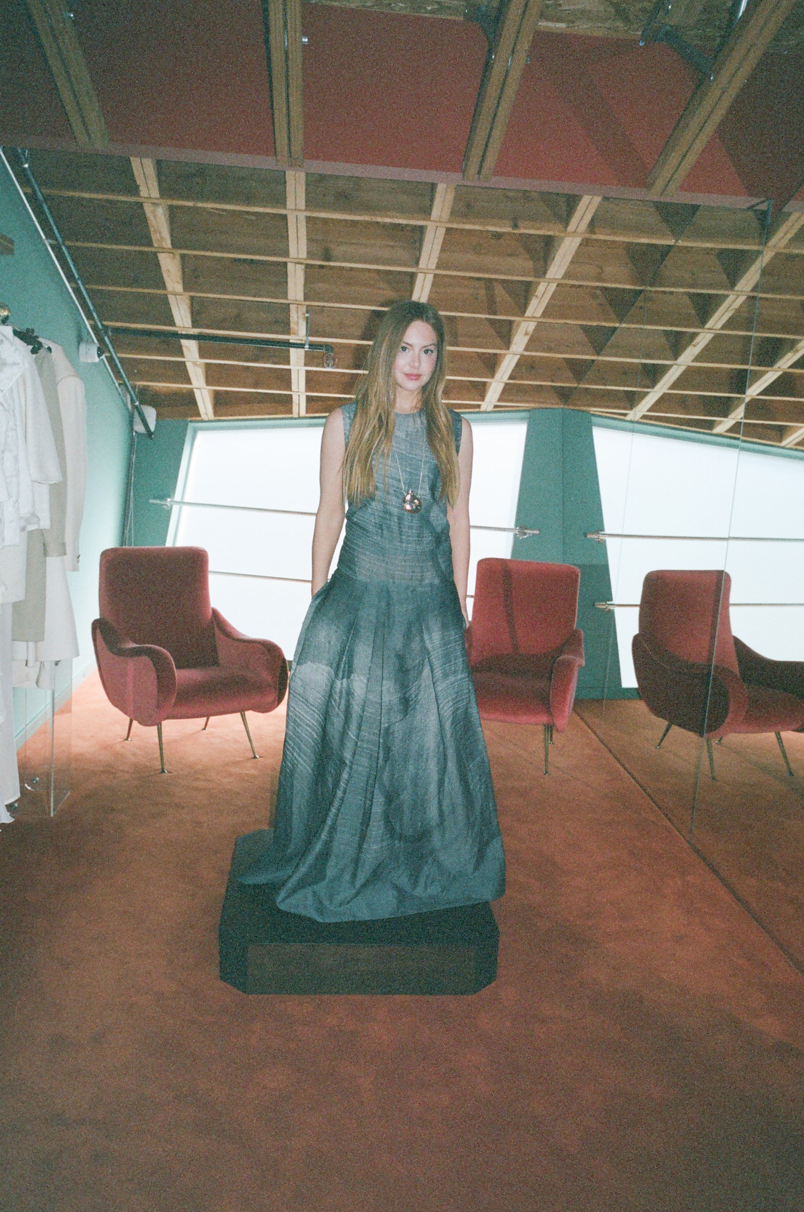 Images may contain clothing photography facial people portrait fashion chair furniture and formal wear