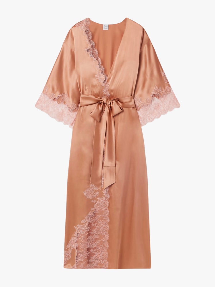 Images may contain: fashion, clothes, robes, dresses, adults, people, formal wear and dresses