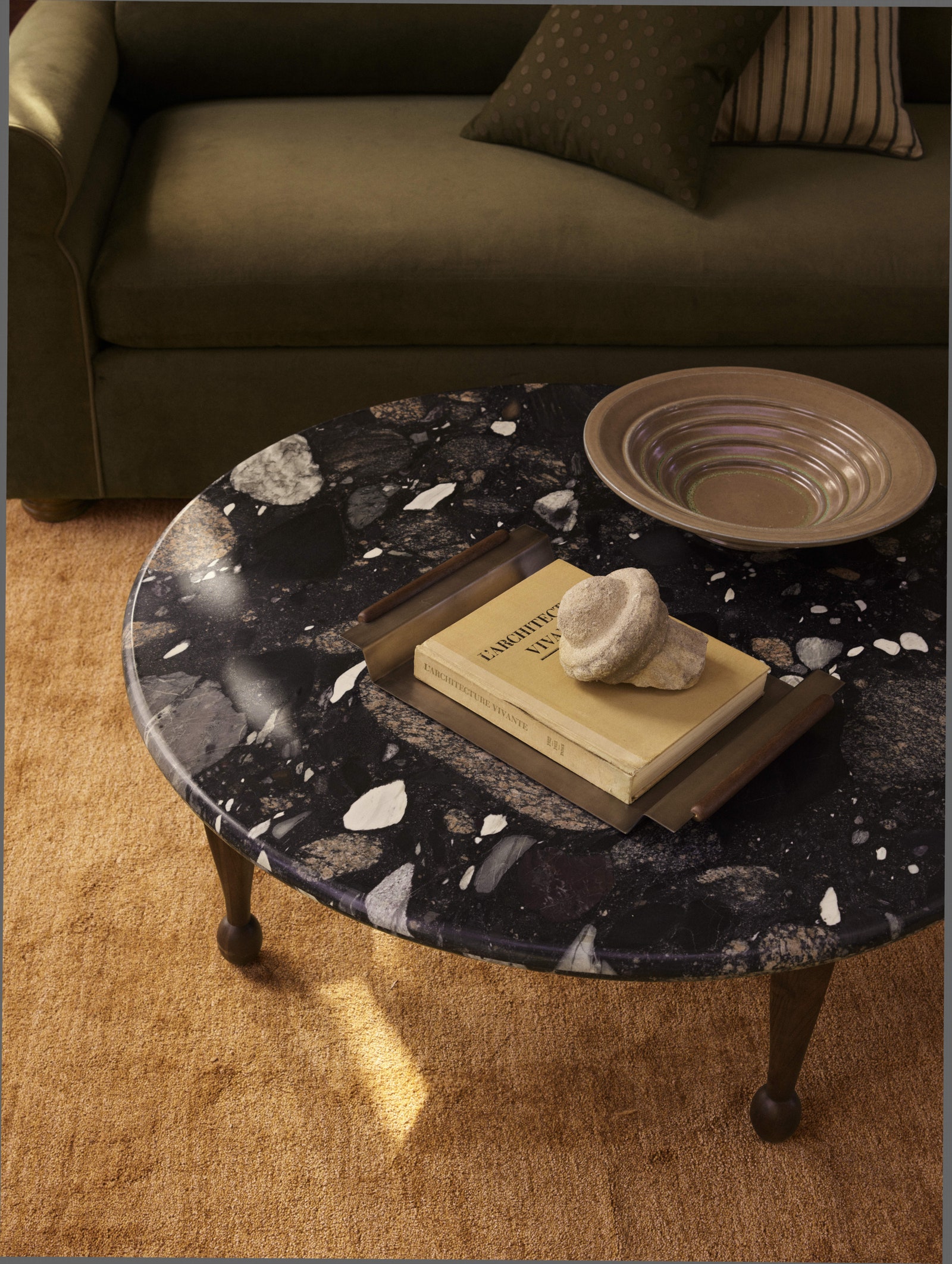 Images may contain coffee table furniture table table top sofa publications and trays