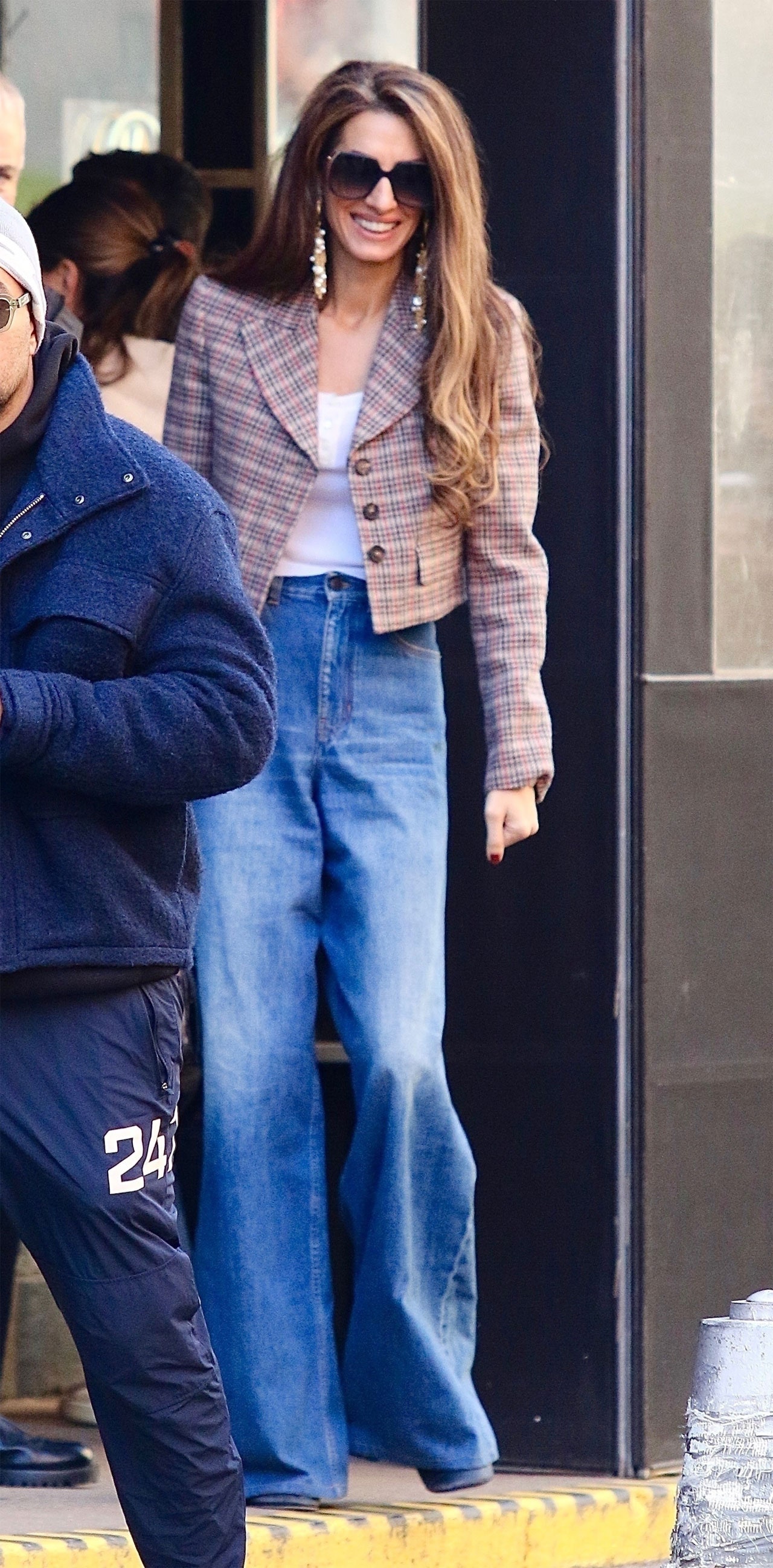 Images may contain Amal Clooney Clothing Pants Jeans Adult Shoes Accessories Glasses and Blazers
