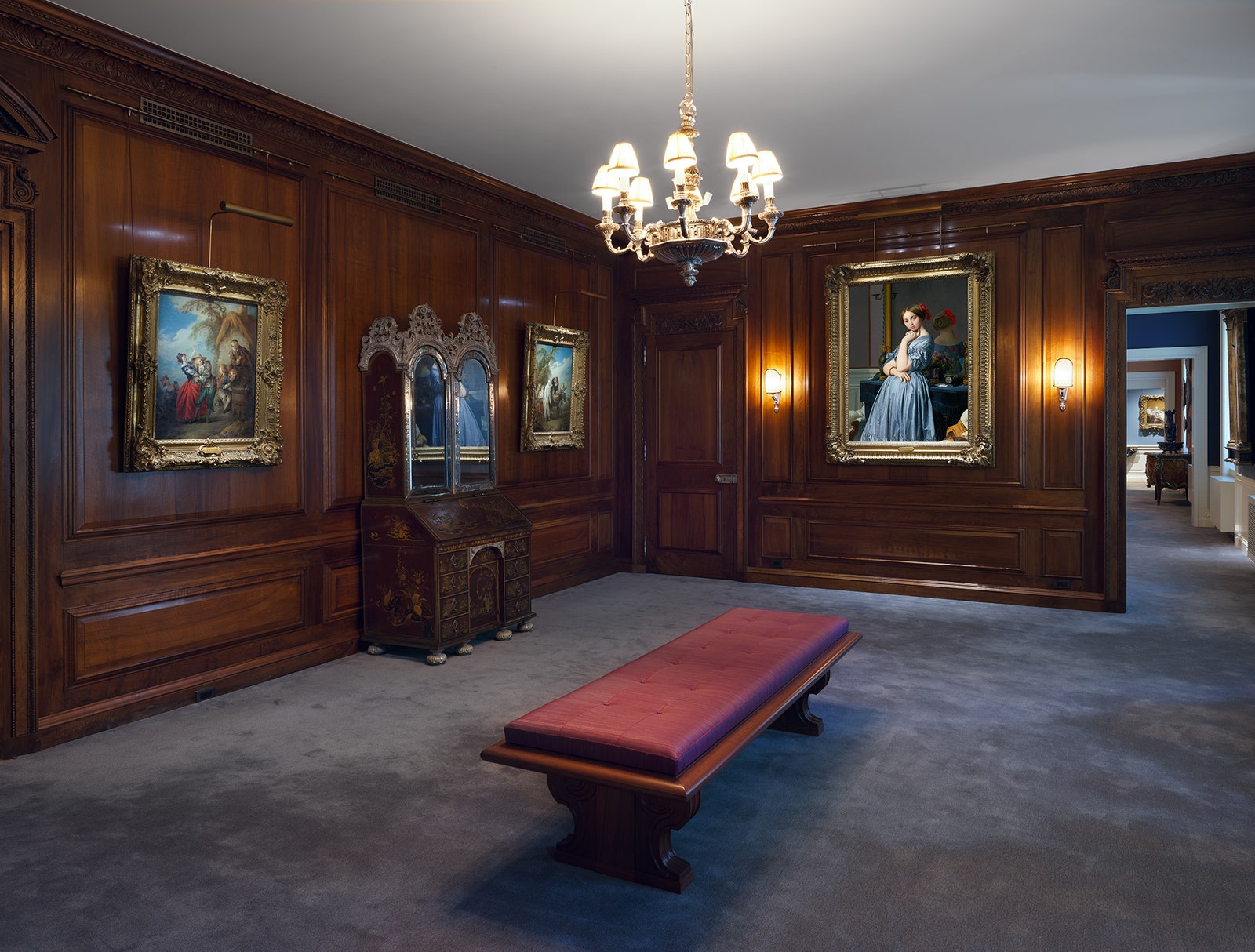 Image may contain chandeliers bench furniture art painting staff in interior design table and table