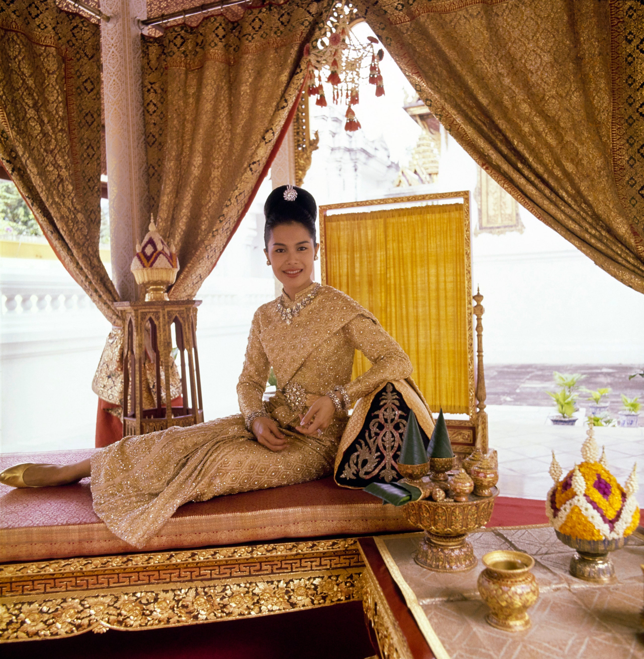 Images may contain Adinia Wirasti furniture Adult wedding bed indoor houseplants and accessories