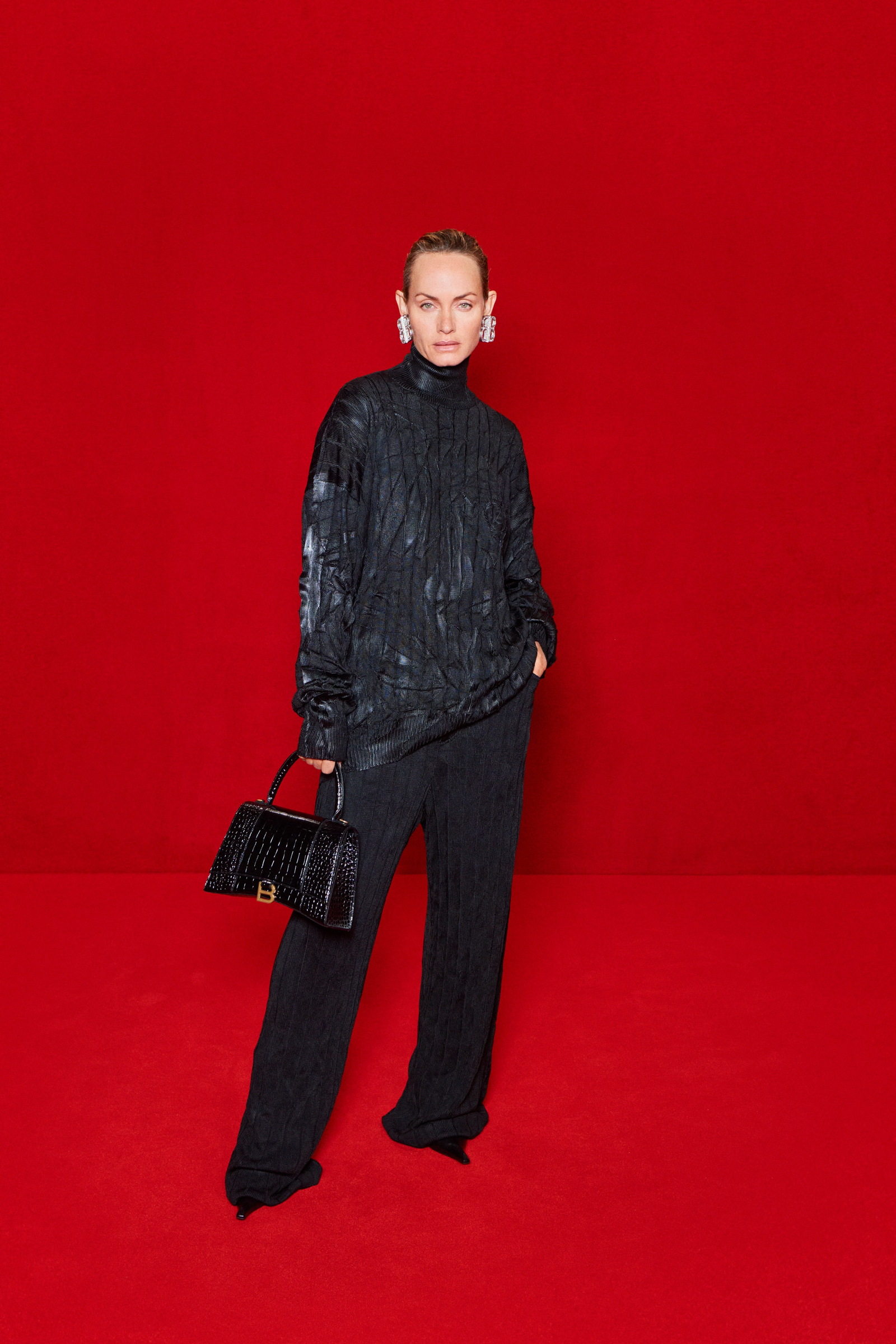 Images may contain amber Valletta Fashion Accessories Bag Handbag Handbag Adult Face and Clothes