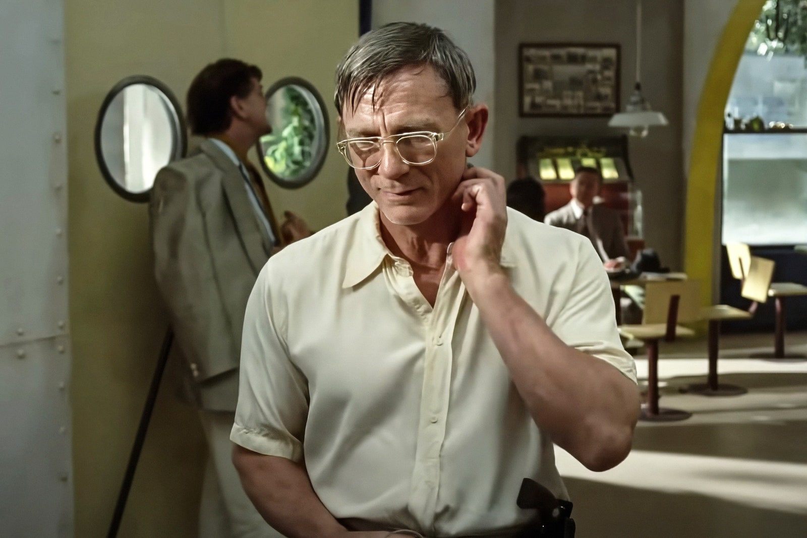 Images may contain Daniel Craig's head man's face adult accessories glasses angry formal wear tie and photo frame
