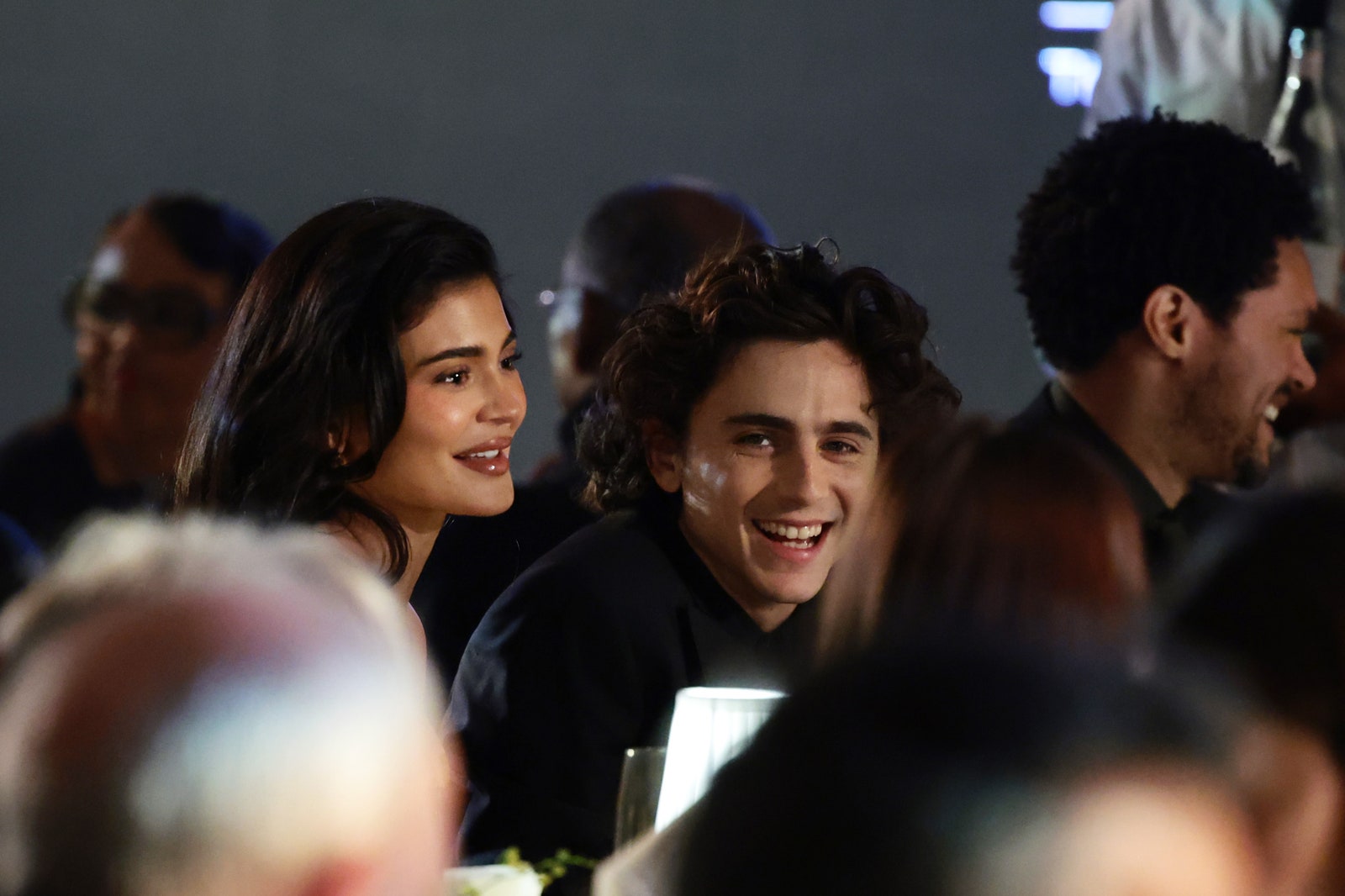 Image may contain Timothe Chalamet Kylie Jenner face happy man smiling adult and wedding