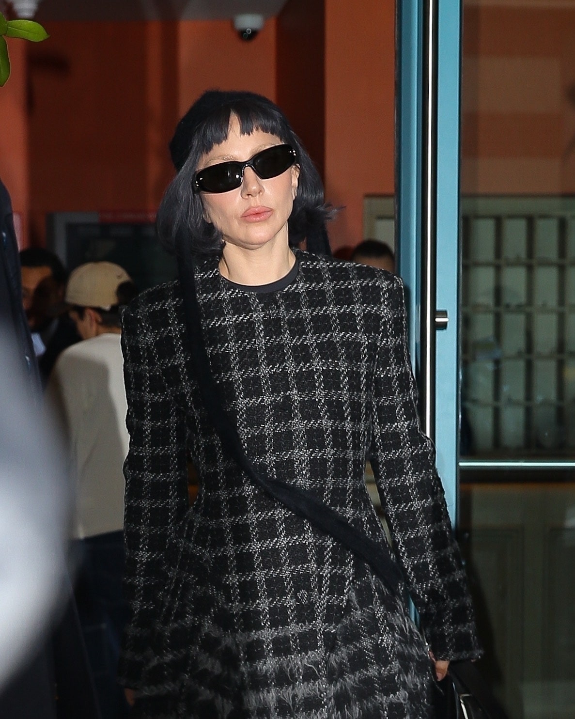 Images may contain Lady Gaga Brunette Brunette Adult Accessories Glasses Hat Bag and Tote Bag