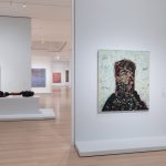 A gallery full of abstract paintings.