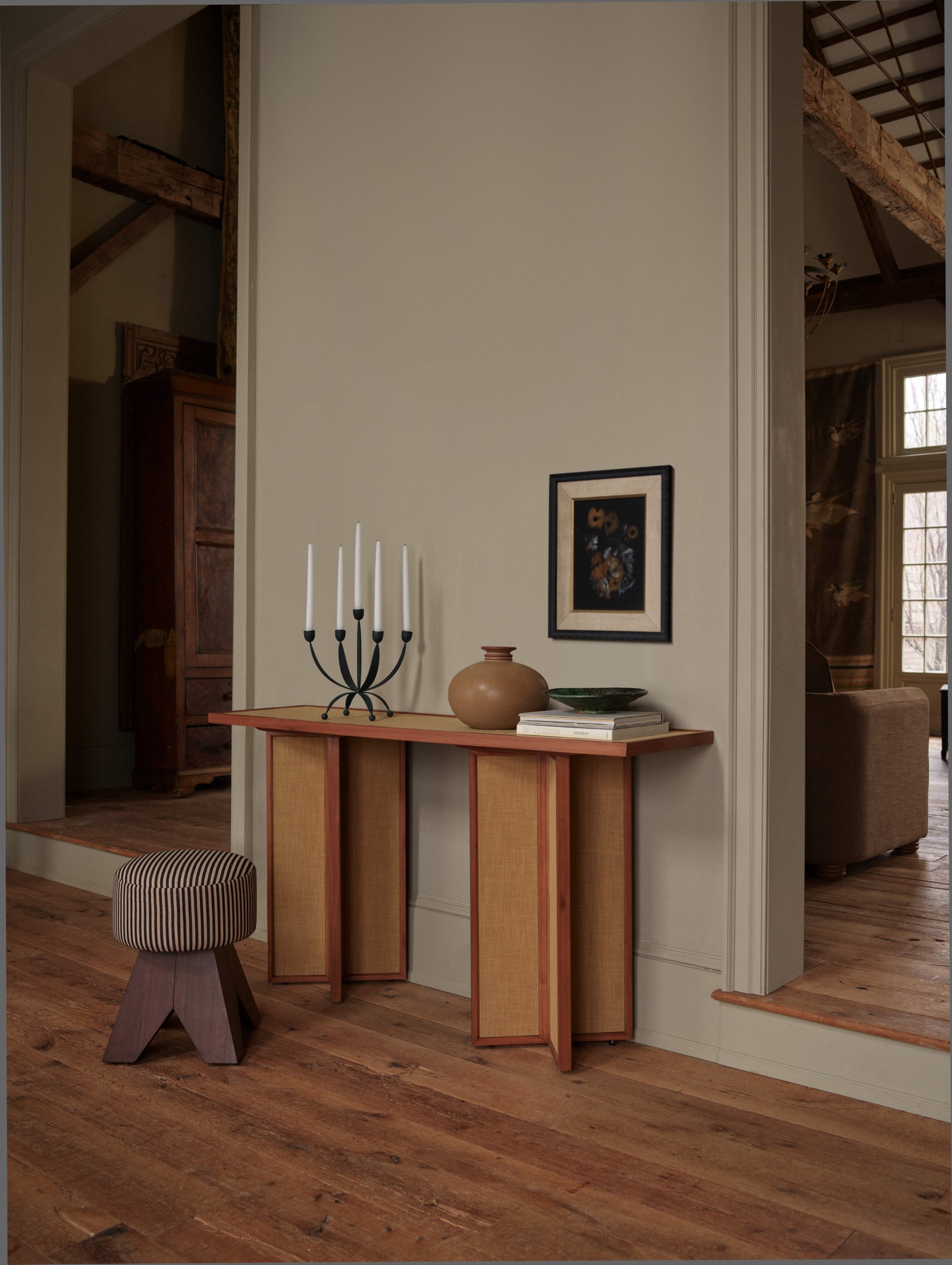 Images may contain corner wood interior design furniture table hardwood floor table and artwork