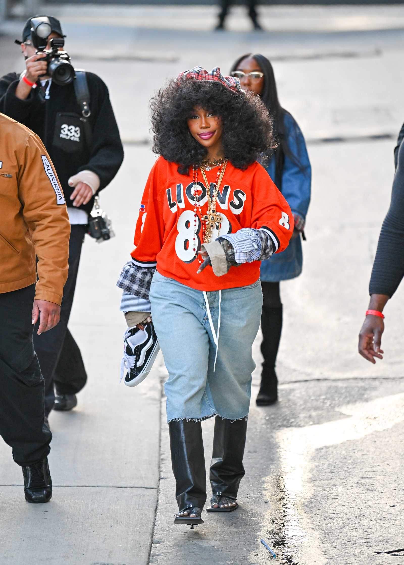 Images may contain SZA Josh Kline clothing shoes, shoes, gloves, bracelets, jewelry and sandals