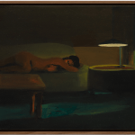 Woman next to woman on sofa.