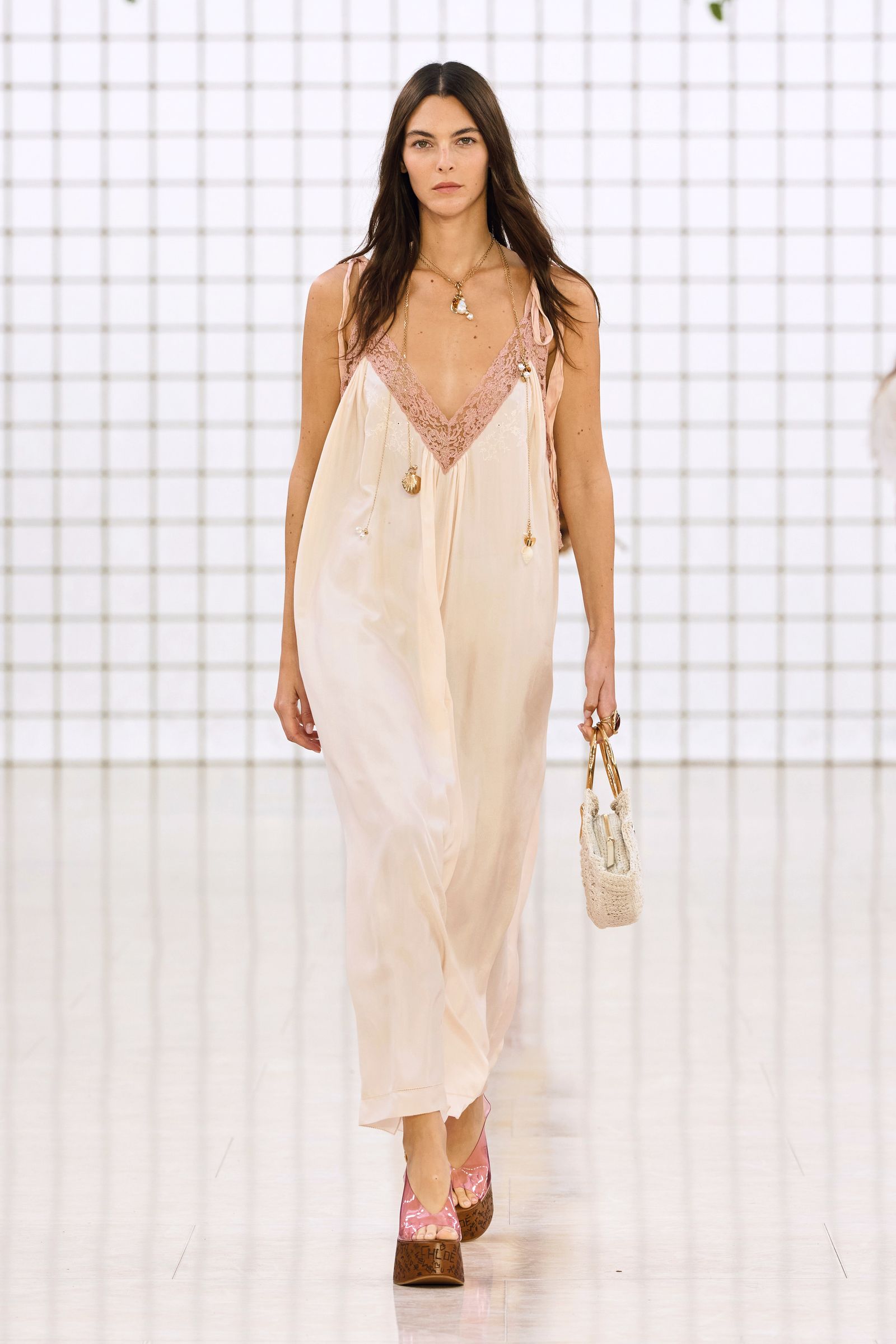 Images may contain Hilary Rhoda adult clothing dresses fashion accessories jewelry necklaces and shoes