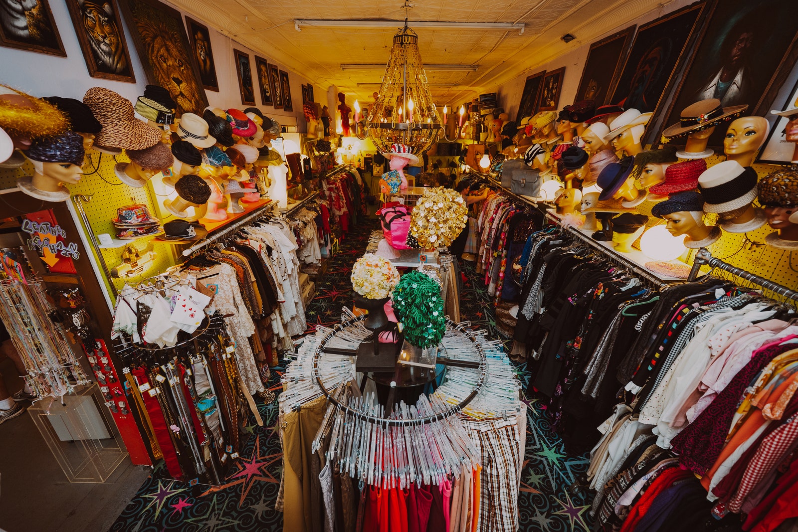 Images may contain lights adult hat hat interior accessories handbag handbag art painting and store