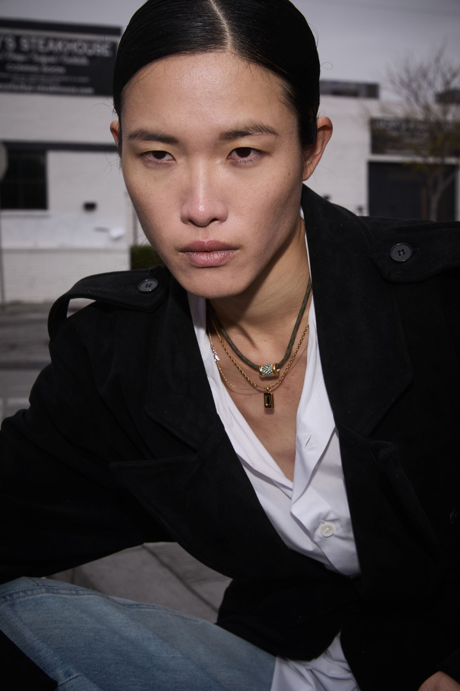 Image may contain facial man photography portrait adult jewelry and necklace