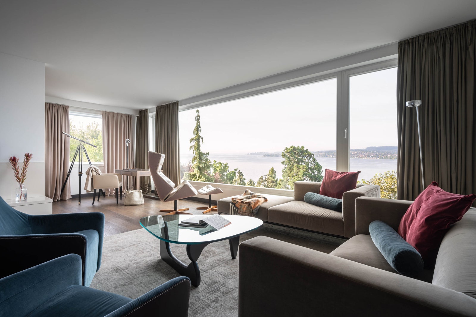Images may contain building in indoor living room coffee table sofa and books
