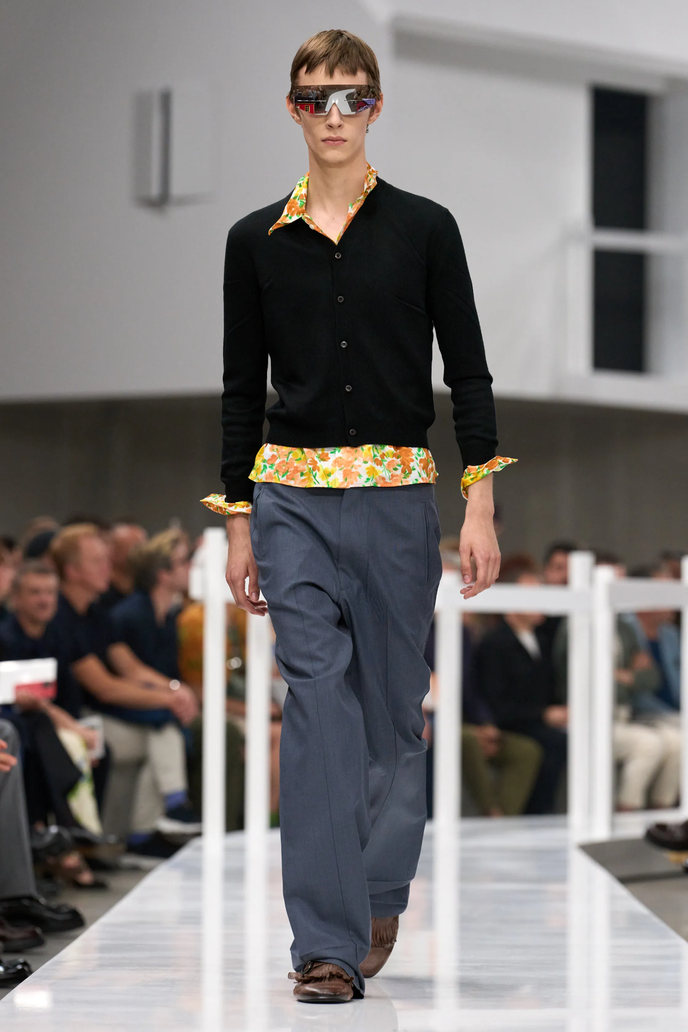 Images may contain clothes pants, fashionable long-sleeved sleeves, adult shirt jacket formal wear and shoes